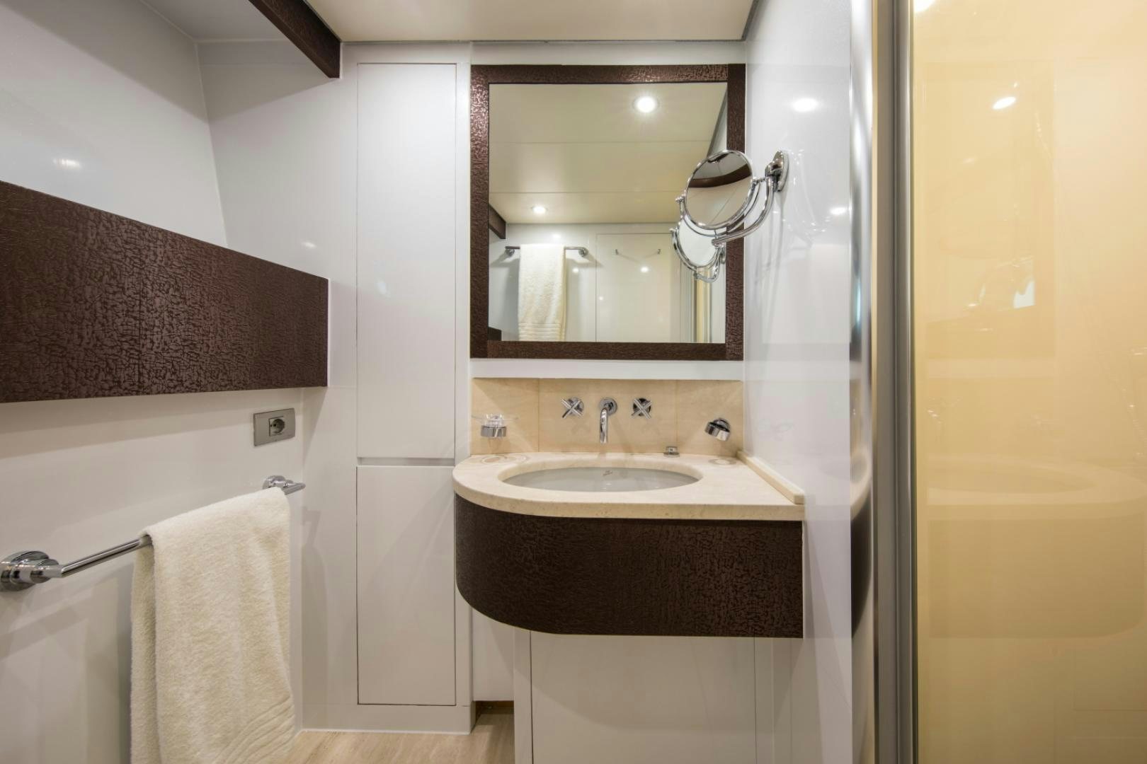 a bathroom with a sink and a mirror aboard MYTHOS Yacht for Sale
