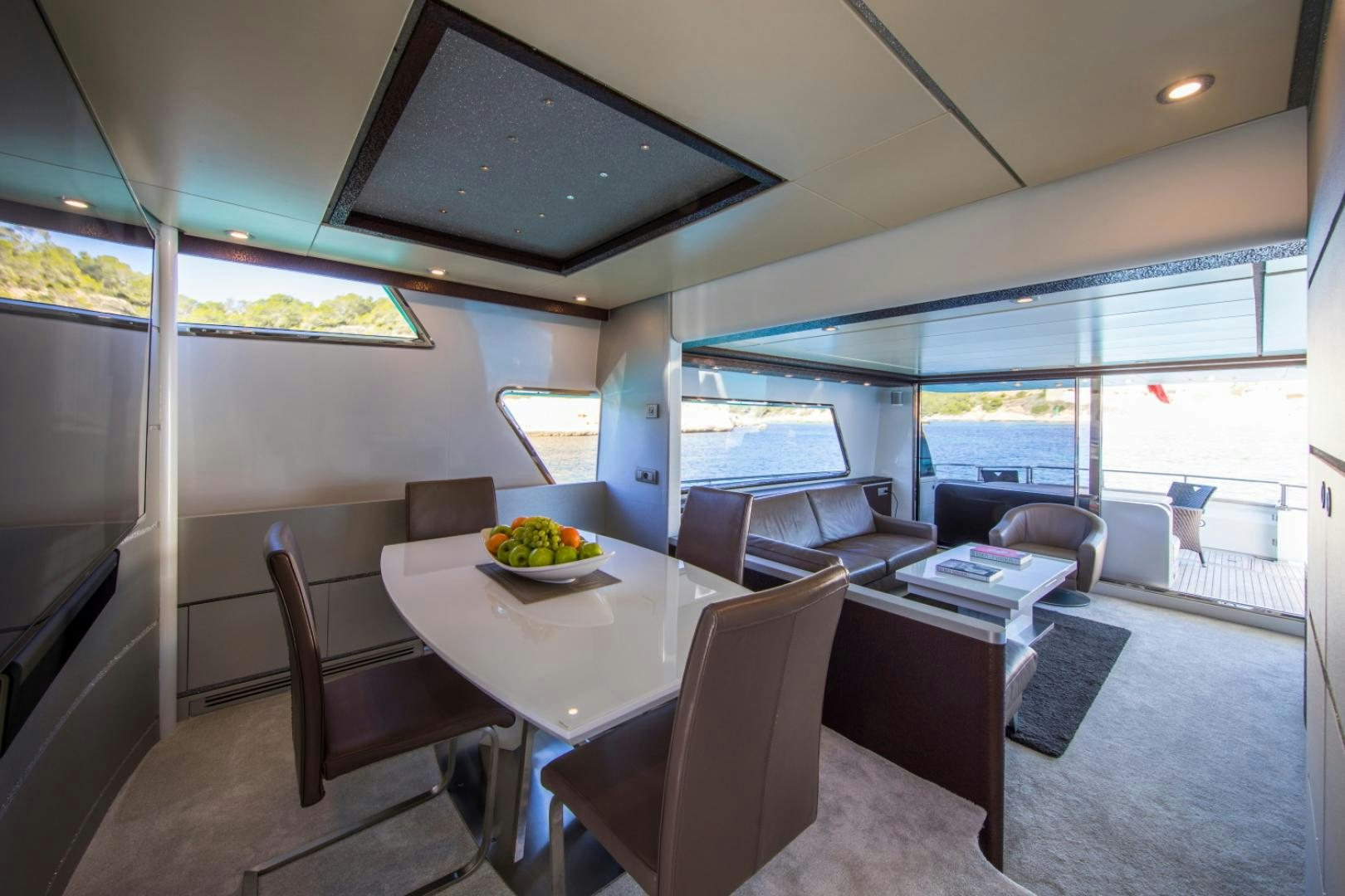 a room with a table and chairs aboard MYTHOS Yacht for Sale