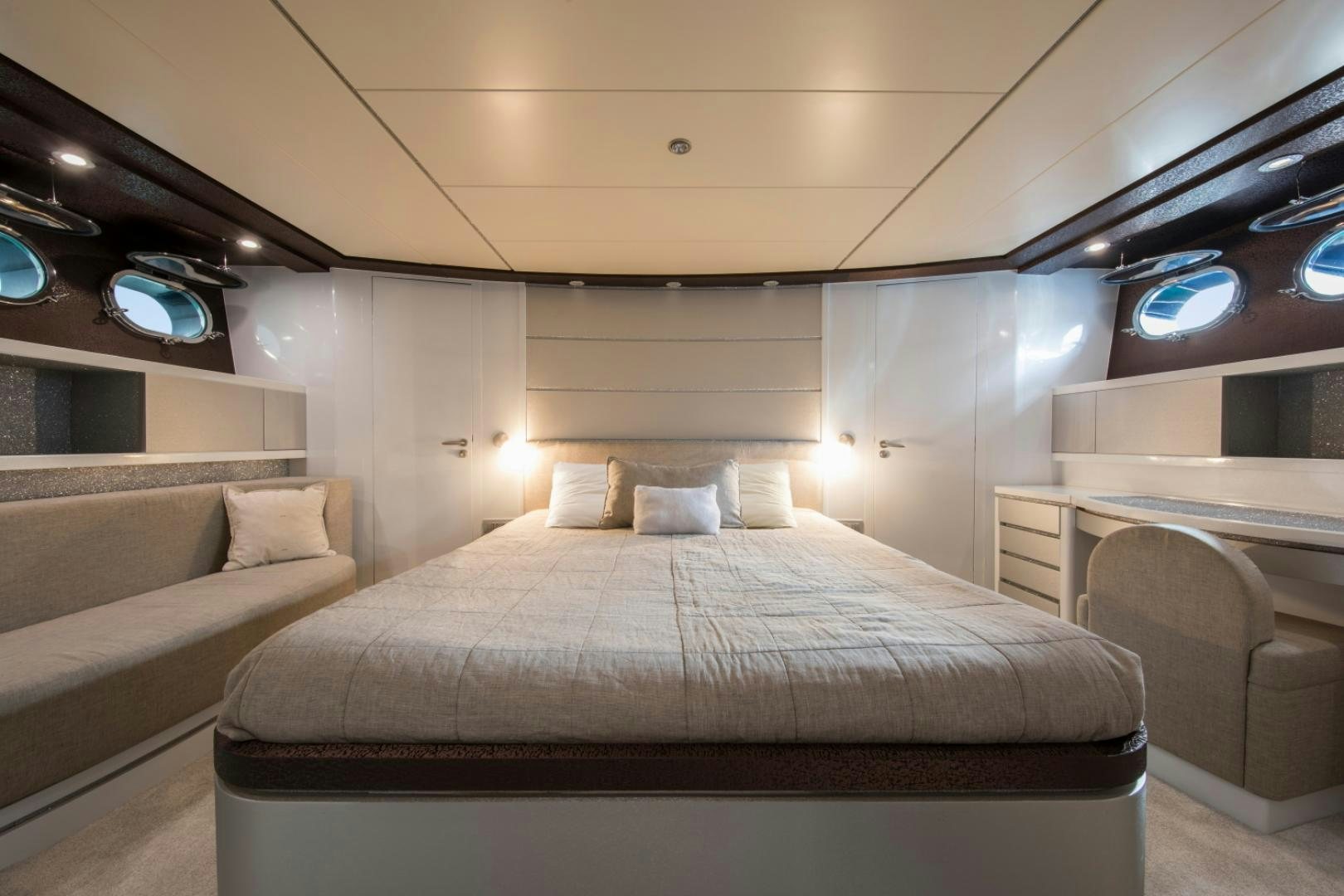 a room with a bed and a desk aboard MYTHOS Yacht for Sale
