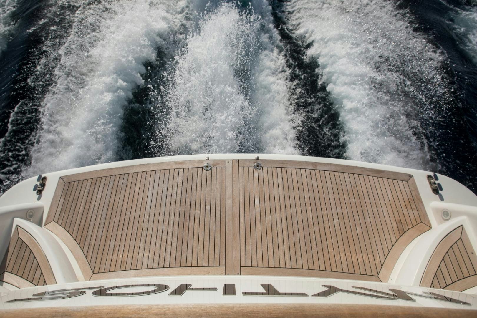 a white boat on a body of water aboard MYTHOS Yacht for Sale