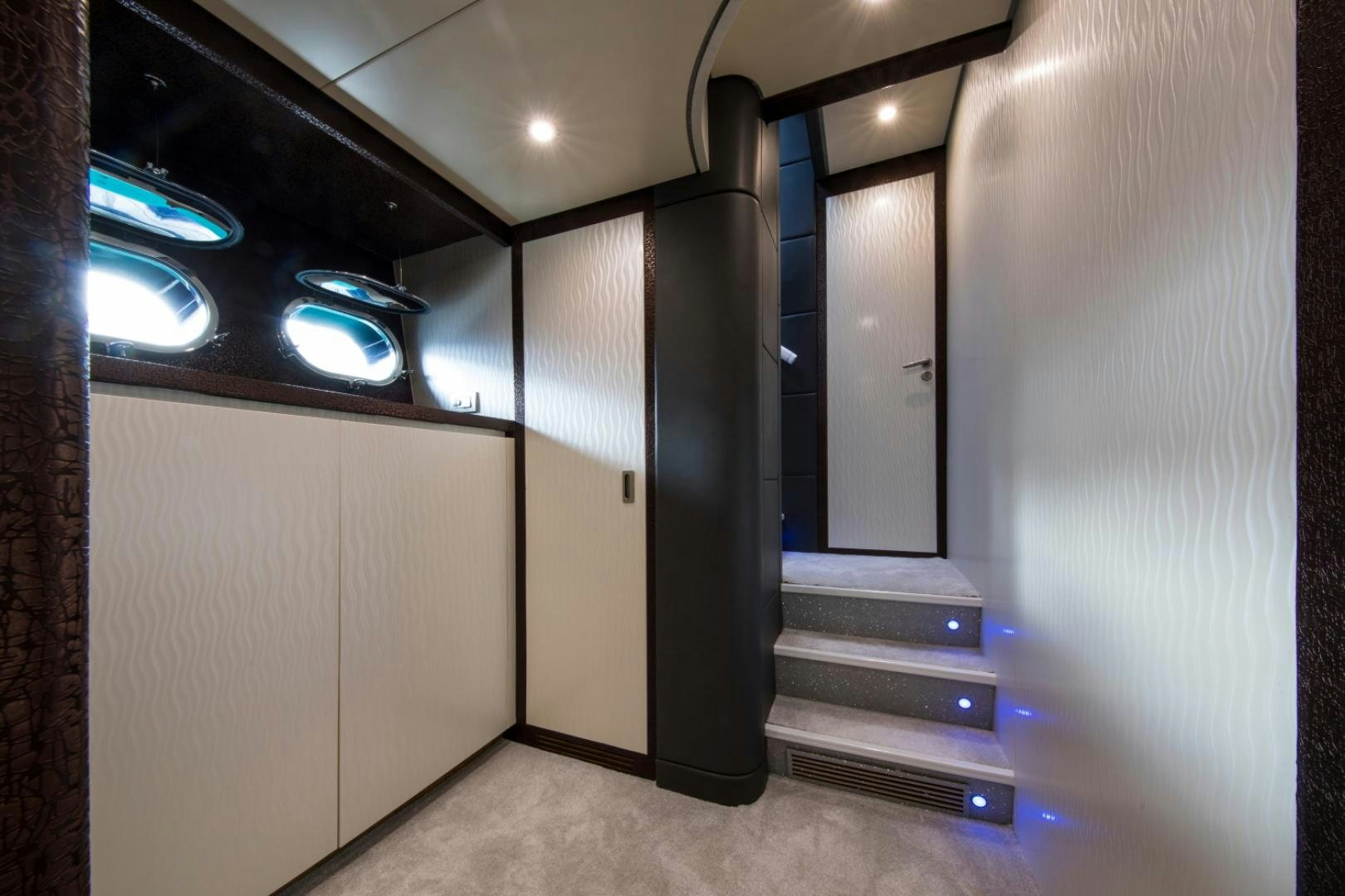 a hallway with doors and a window aboard MYTHOS Yacht for Sale