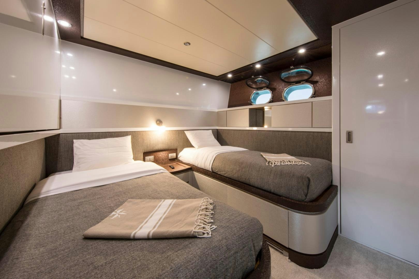 a room with two beds aboard MYTHOS Yacht for Sale