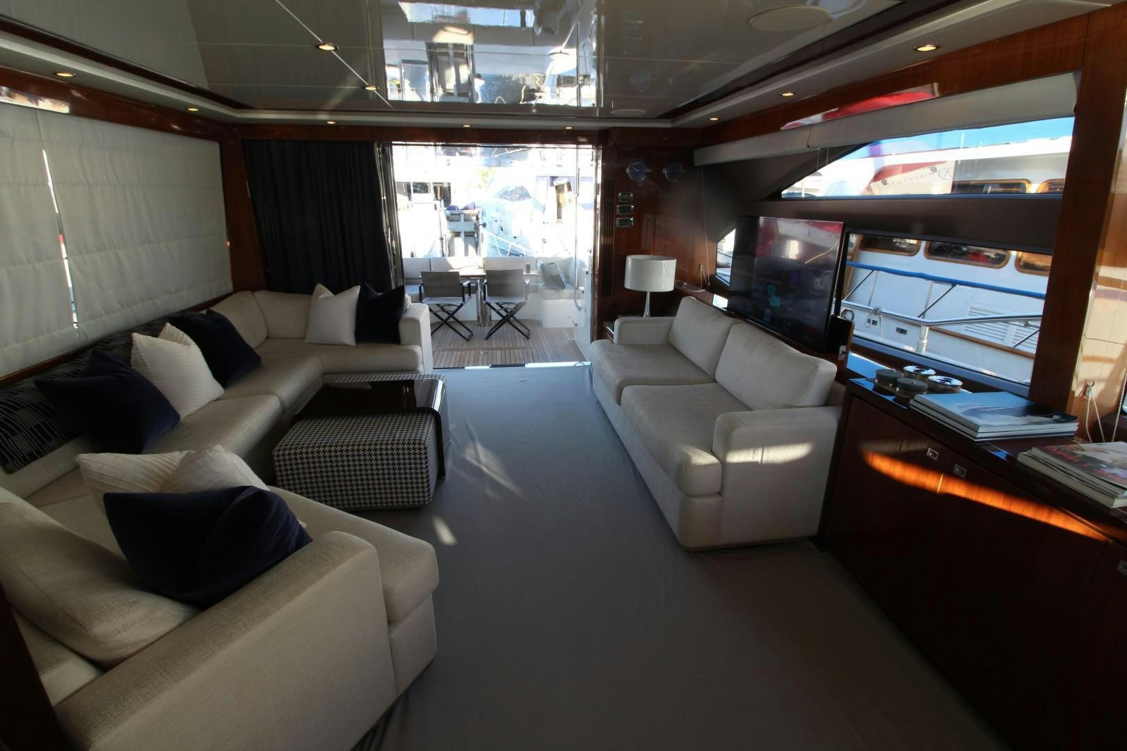 a room with a couch and a table and a window aboard PISCHOS III Yacht for Sale