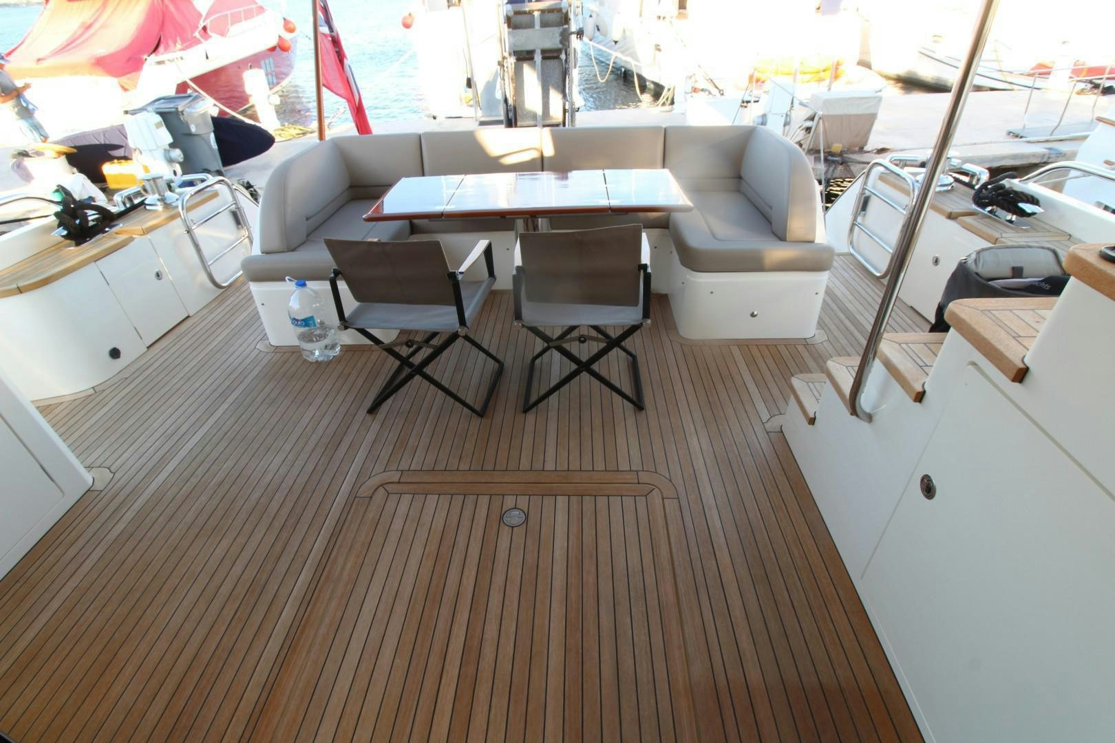 a room with a couch and a table aboard PISCHOS III Yacht for Sale