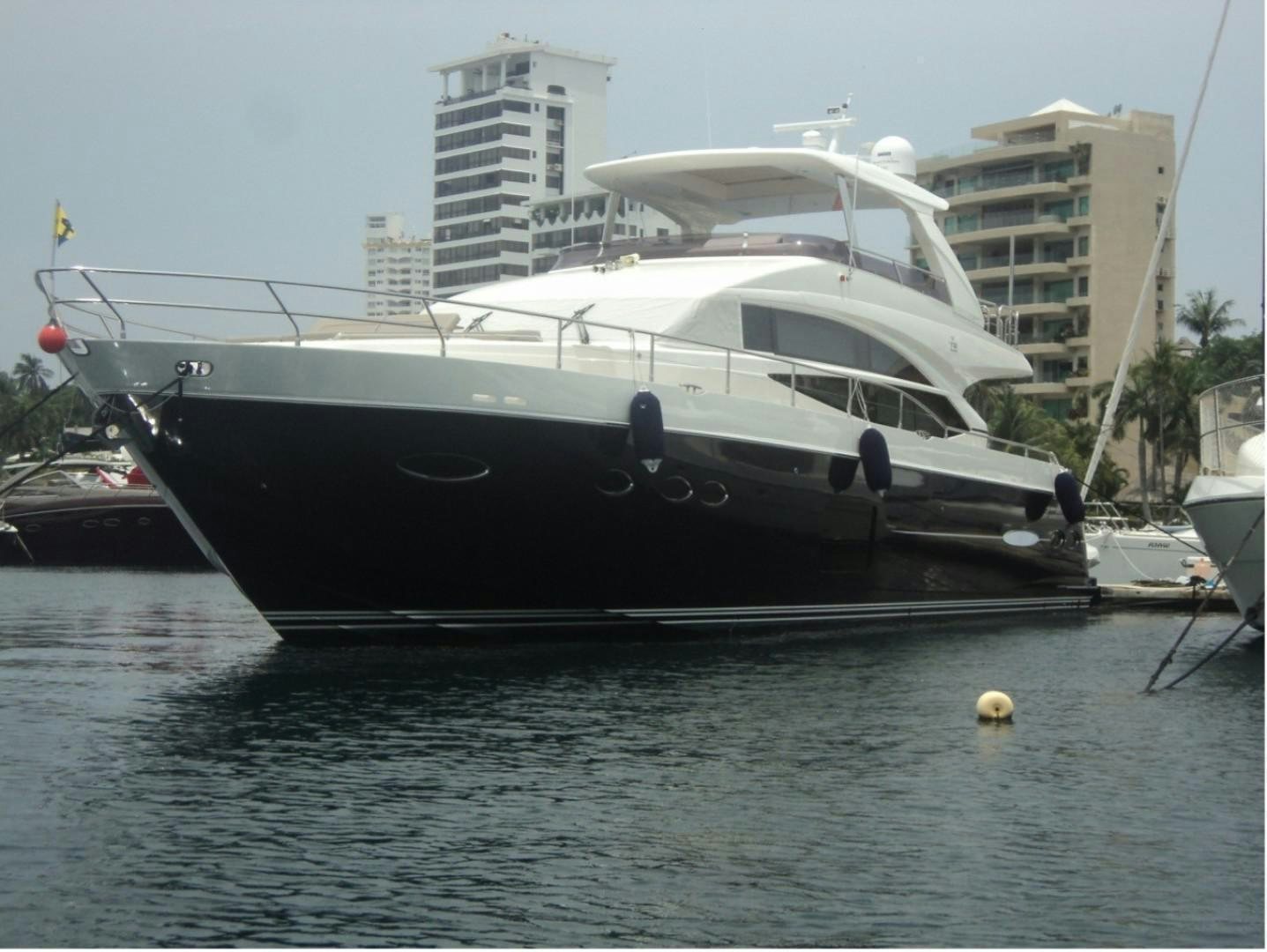 a boat docked in a harbor aboard PISCHOS III Yacht for Sale