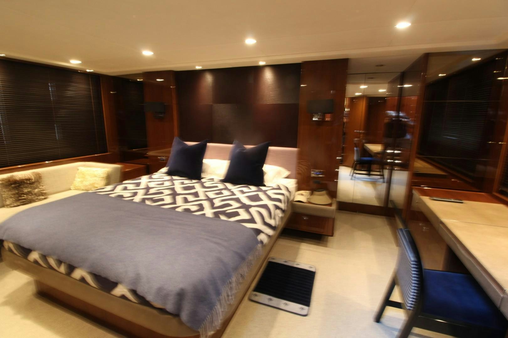 a hotel room with a bed aboard PISCHOS III Yacht for Sale