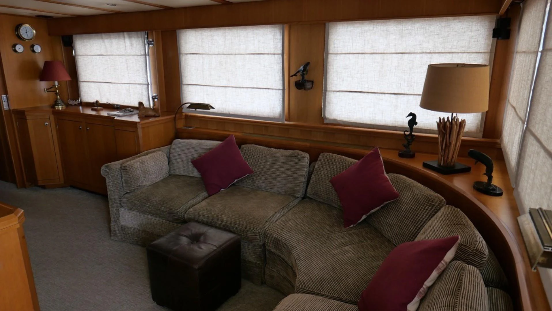 a living room with a couch and a lamp aboard PELAGIAL Yacht for Sale