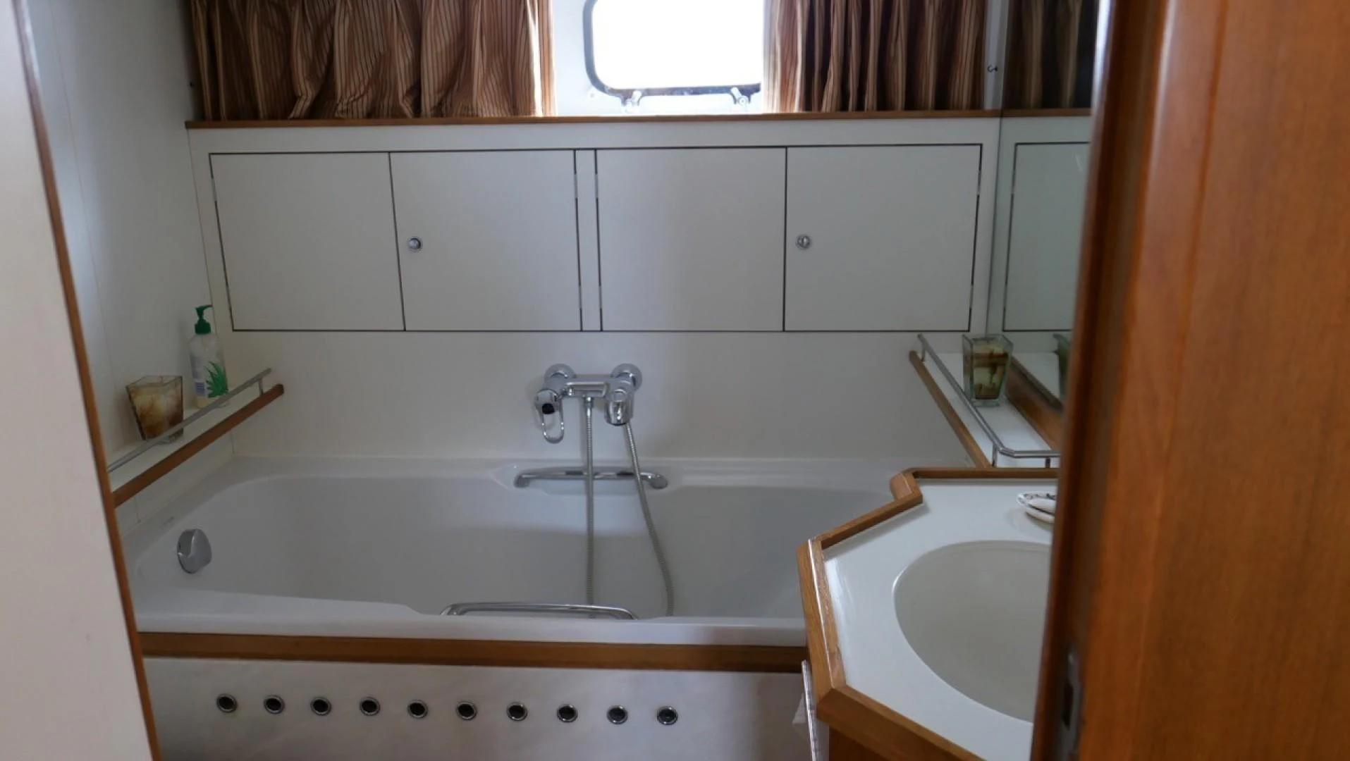 a bathtub and sink in a bathroom aboard PELAGIAL Yacht for Sale