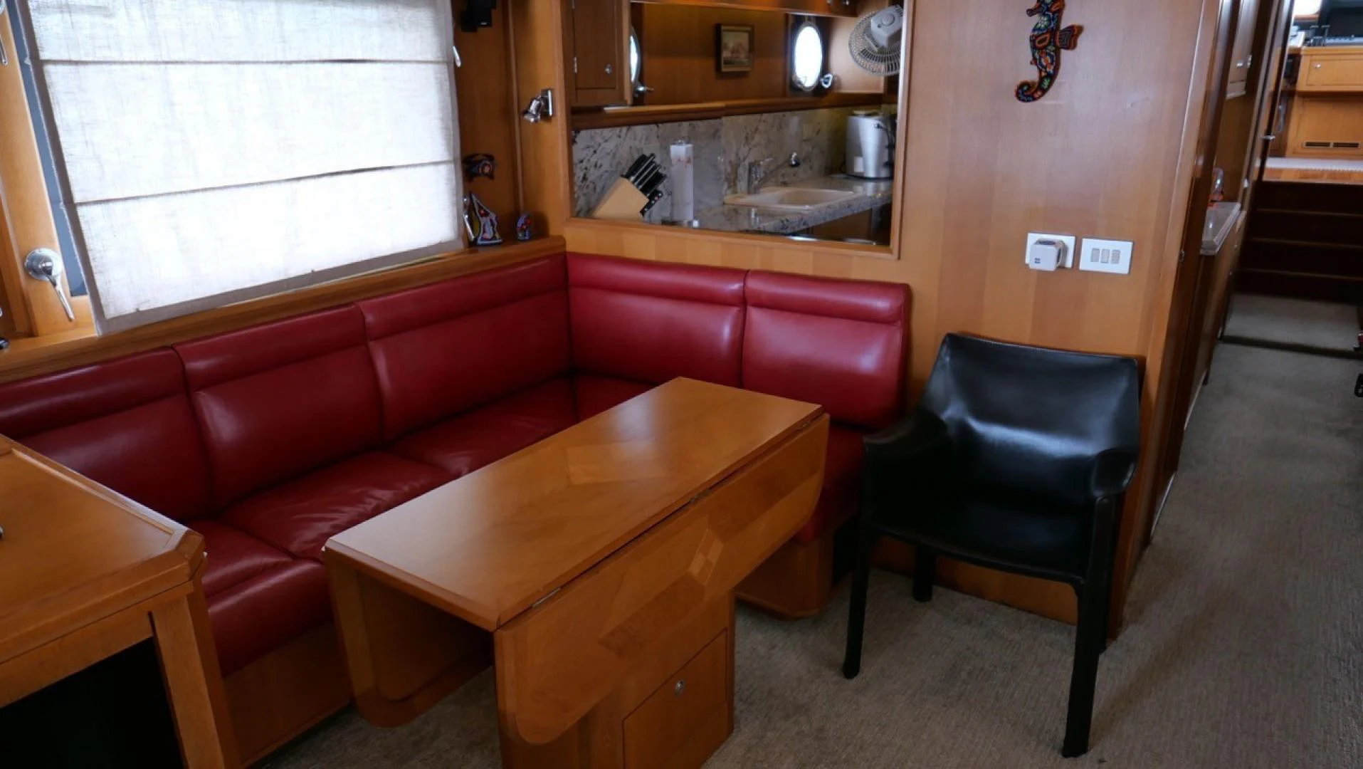 a kitchen and dining room area aboard PELAGIAL Yacht for Sale