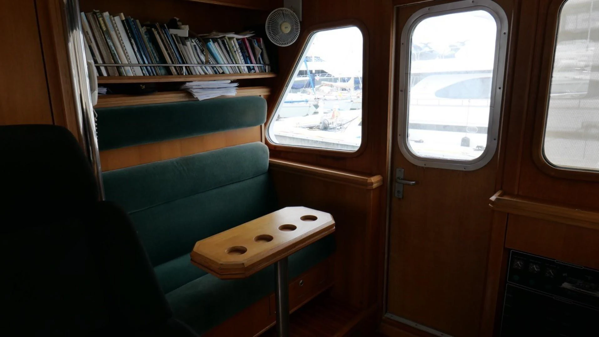 a room with a bench and a table aboard PELAGIAL Yacht for Sale