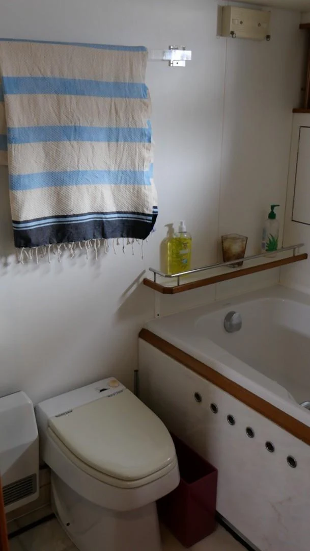 a bathroom with a toilet and sink aboard PELAGIAL Yacht for Sale