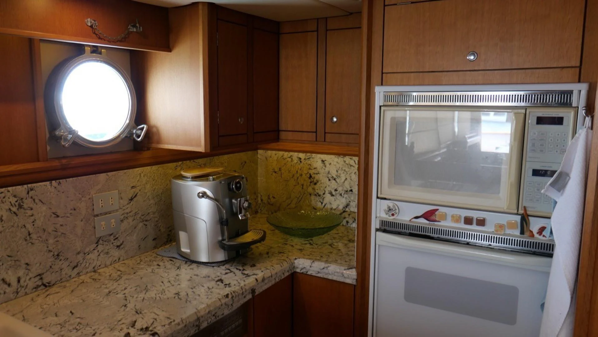 a microwave oven and a microwave in a kitchen aboard PELAGIAL Yacht for Sale