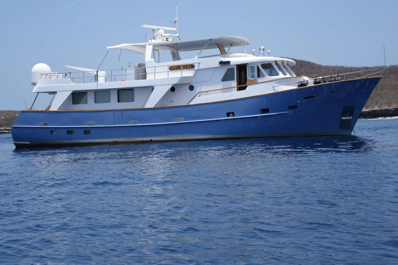 a large boat in the water aboard PELAGIAL Yacht for Sale