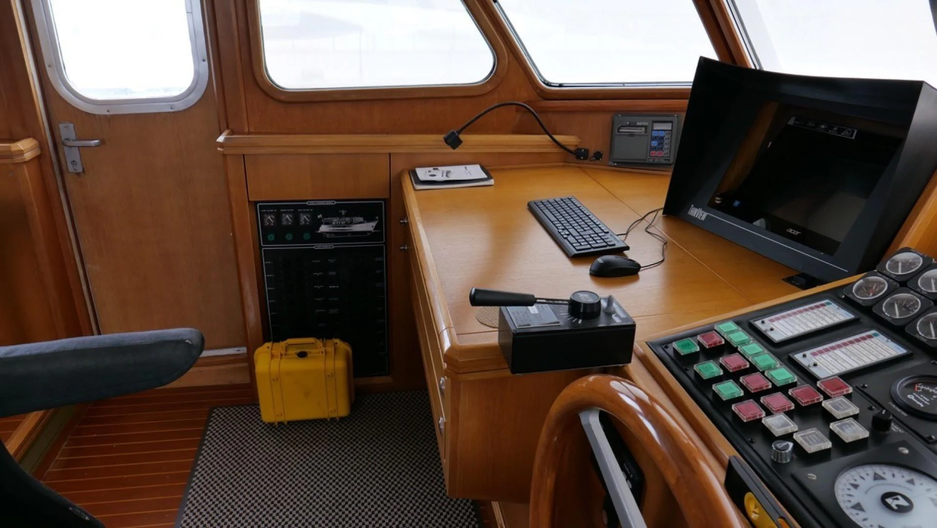 a desk with a computer and a keyboard aboard PELAGIAL Yacht for Sale