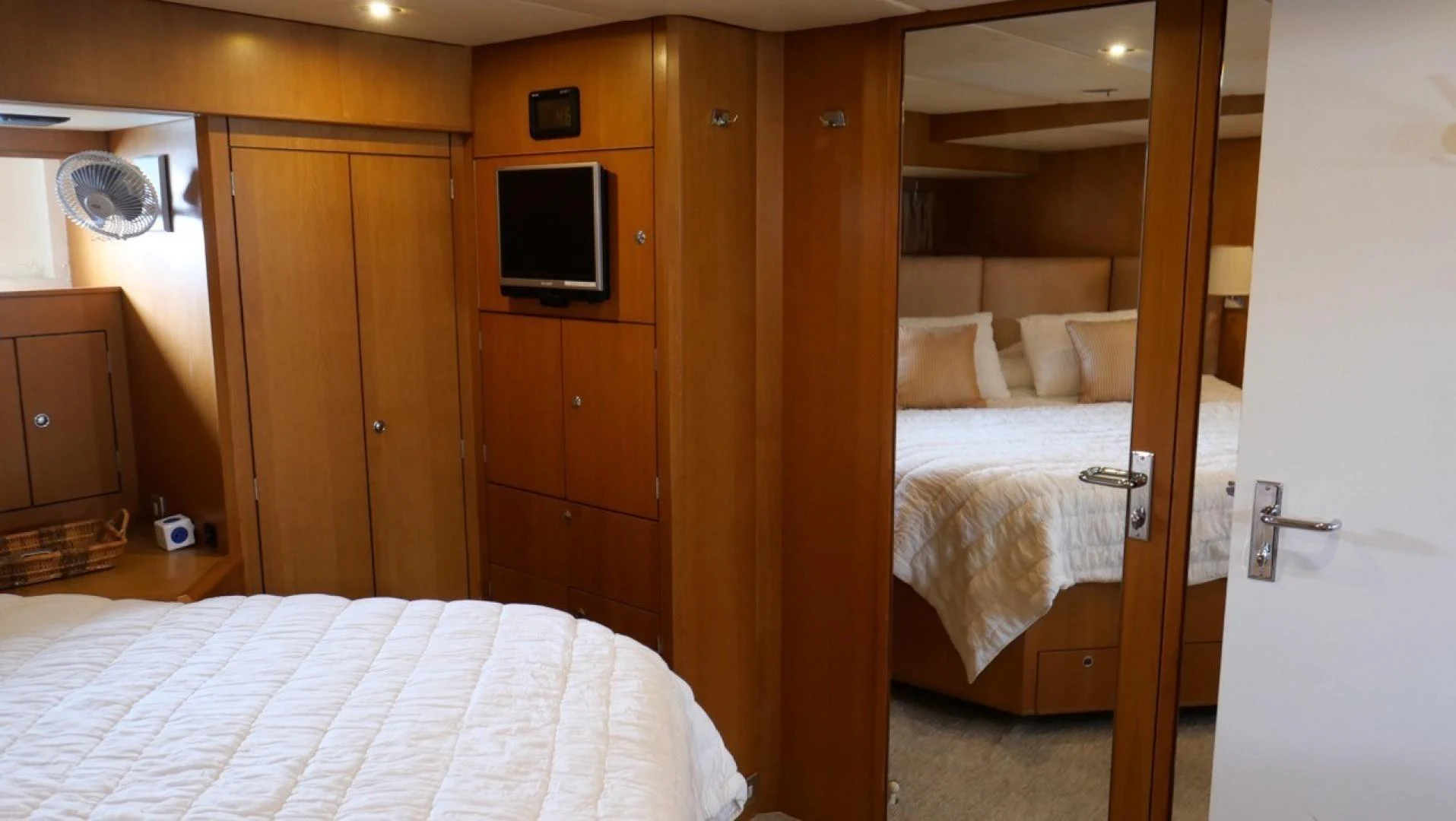 a room with a bed and a television aboard PELAGIAL Yacht for Sale