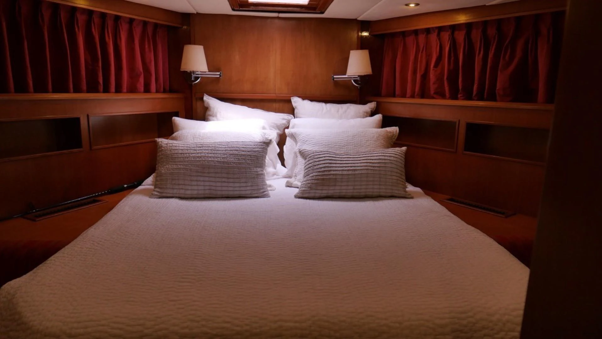 a bed with pillows aboard PELAGIAL Yacht for Sale