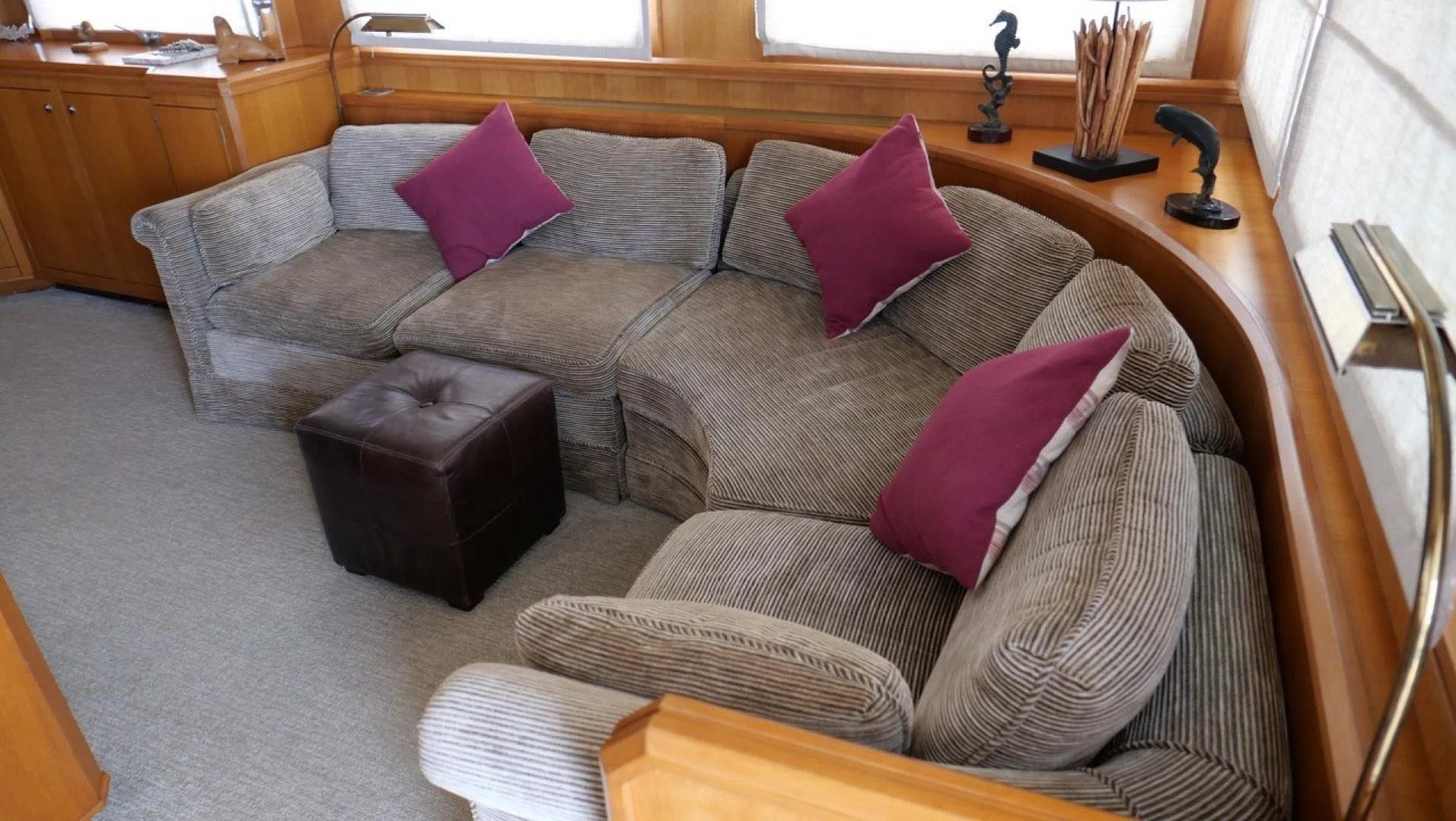 a couch with pillows aboard PELAGIAL Yacht for Sale