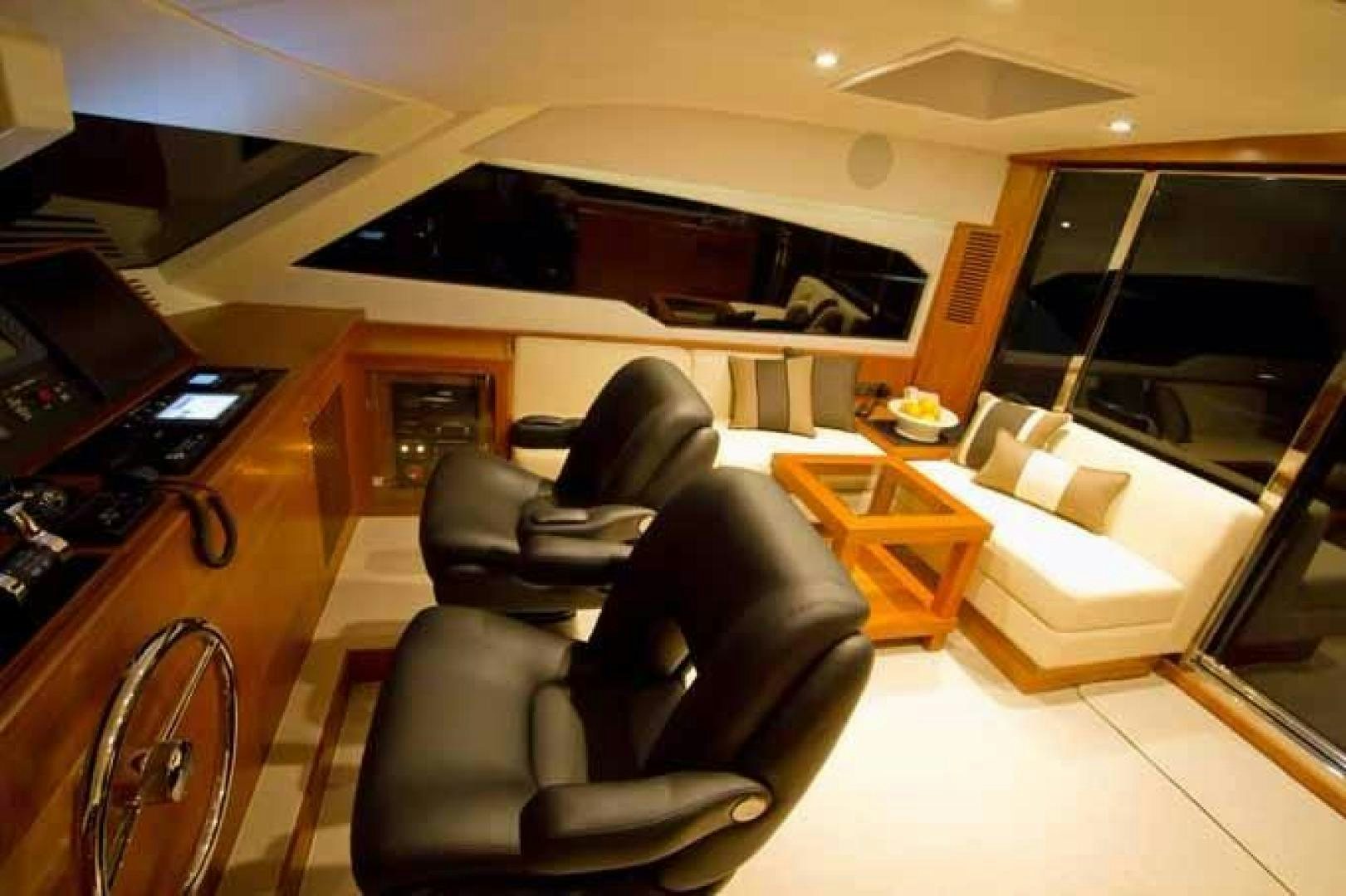 a room with a couch and a piano aboard JOHNSON 70 SKYLOUNGE NEW BUILD Yacht for Sale