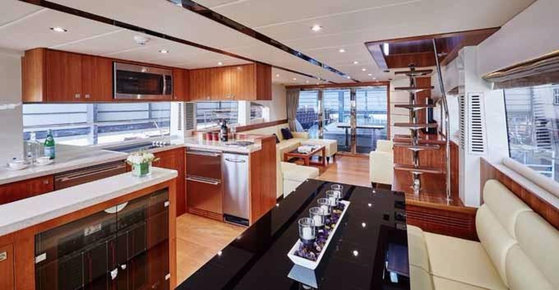 a kitchen with a large island aboard JOHNSON 70 SKYLOUNGE NEW BUILD Yacht for Sale