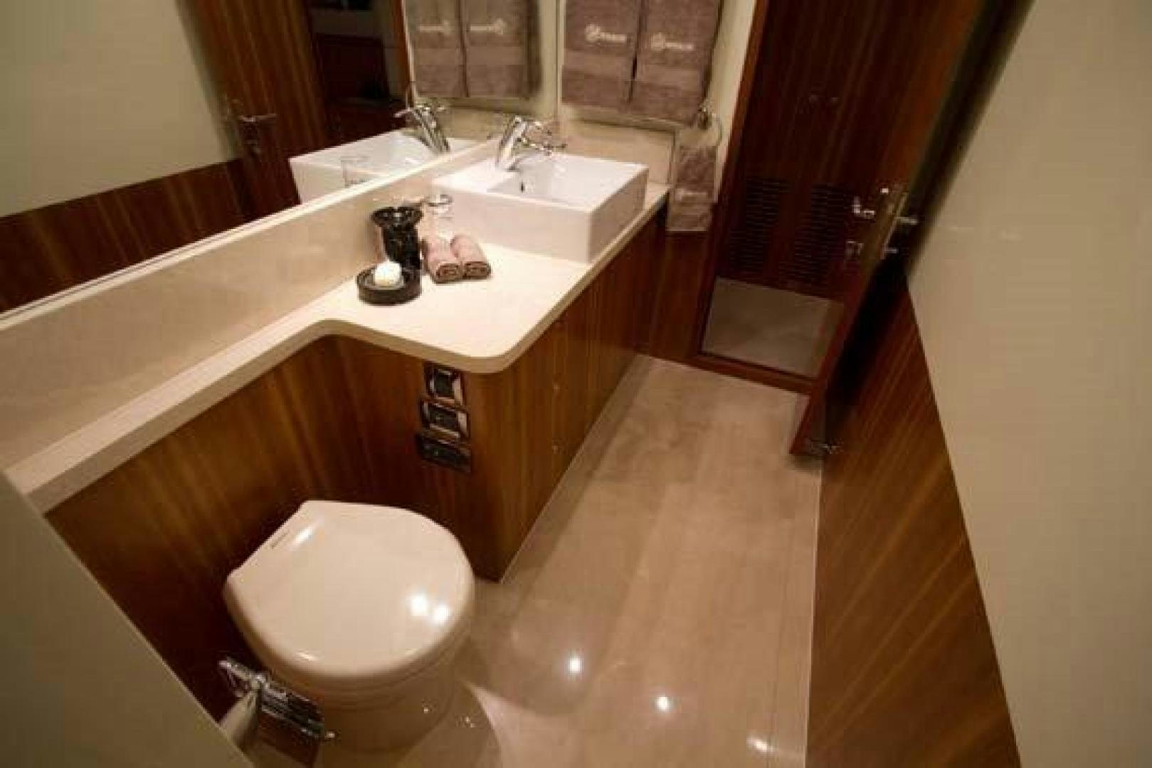 a bathroom with a sink and a toilet aboard JOHNSON 70 SKYLOUNGE NEW BUILD Yacht for Sale