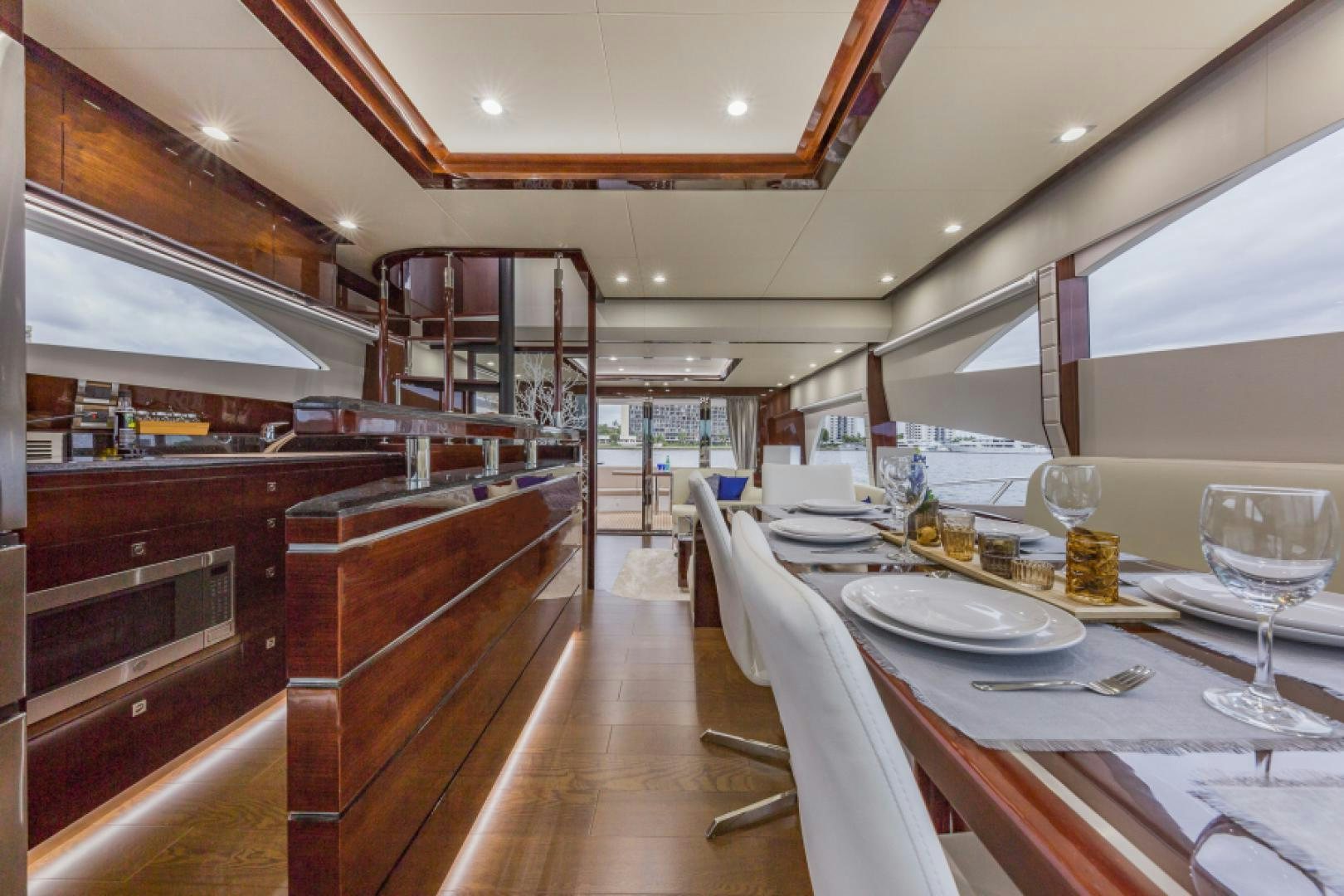 a large kitchen with a dining table aboard No Name Yacht for Sale