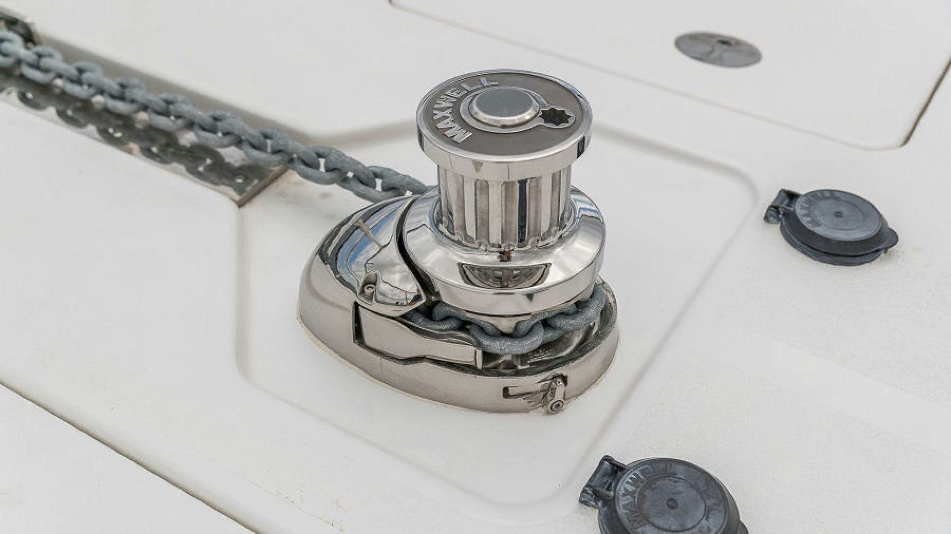 a silver and silver watch on a white surface aboard No Name Yacht for Sale