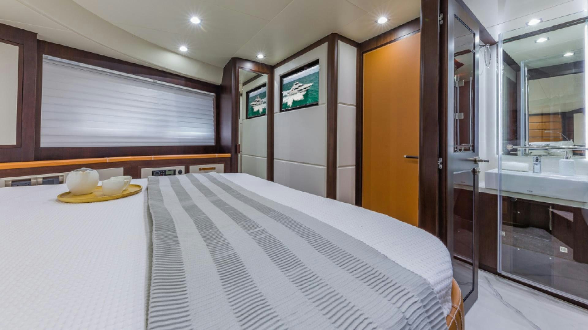 a large room with a bed and a desk aboard No Name Yacht for Sale