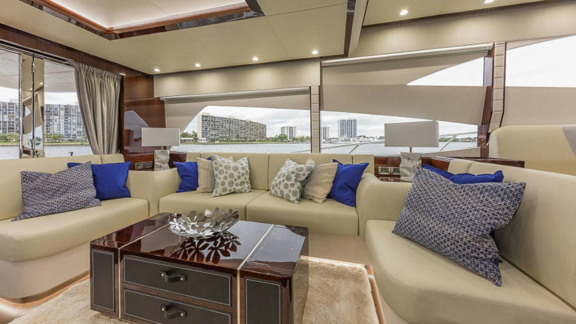 a living room with a couch and a coffee table aboard No Name Yacht for Sale