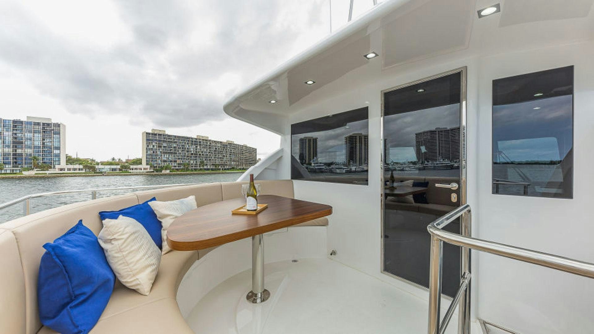 a room with a table and a bed aboard No Name Yacht for Sale