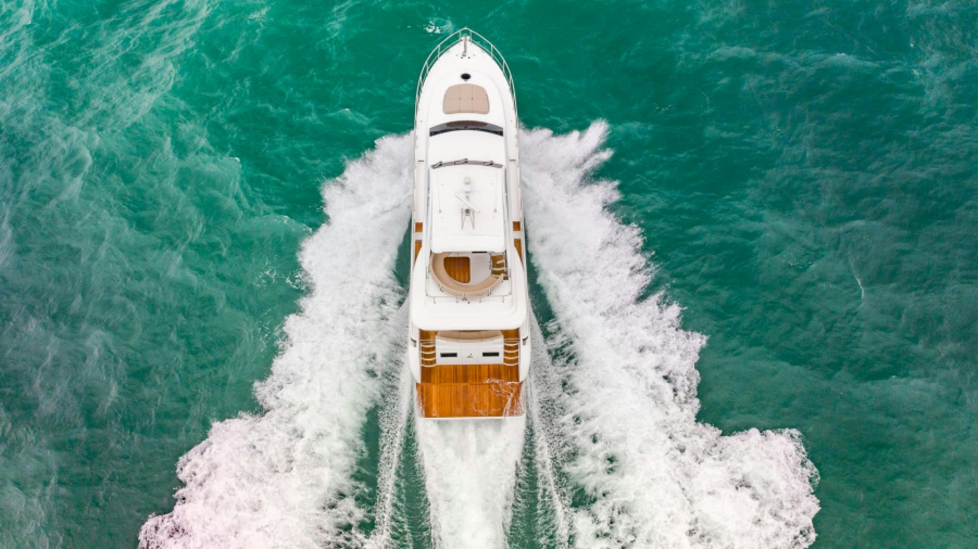 a white boat in the water aboard No Name Yacht for Sale