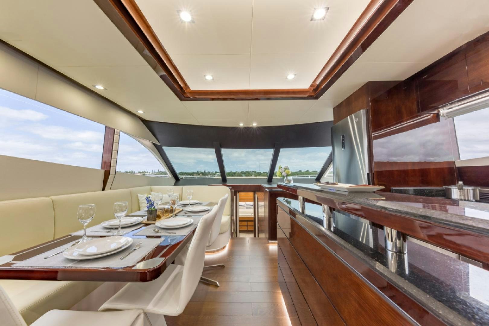 a dining room with a large balcony aboard No Name Yacht for Sale