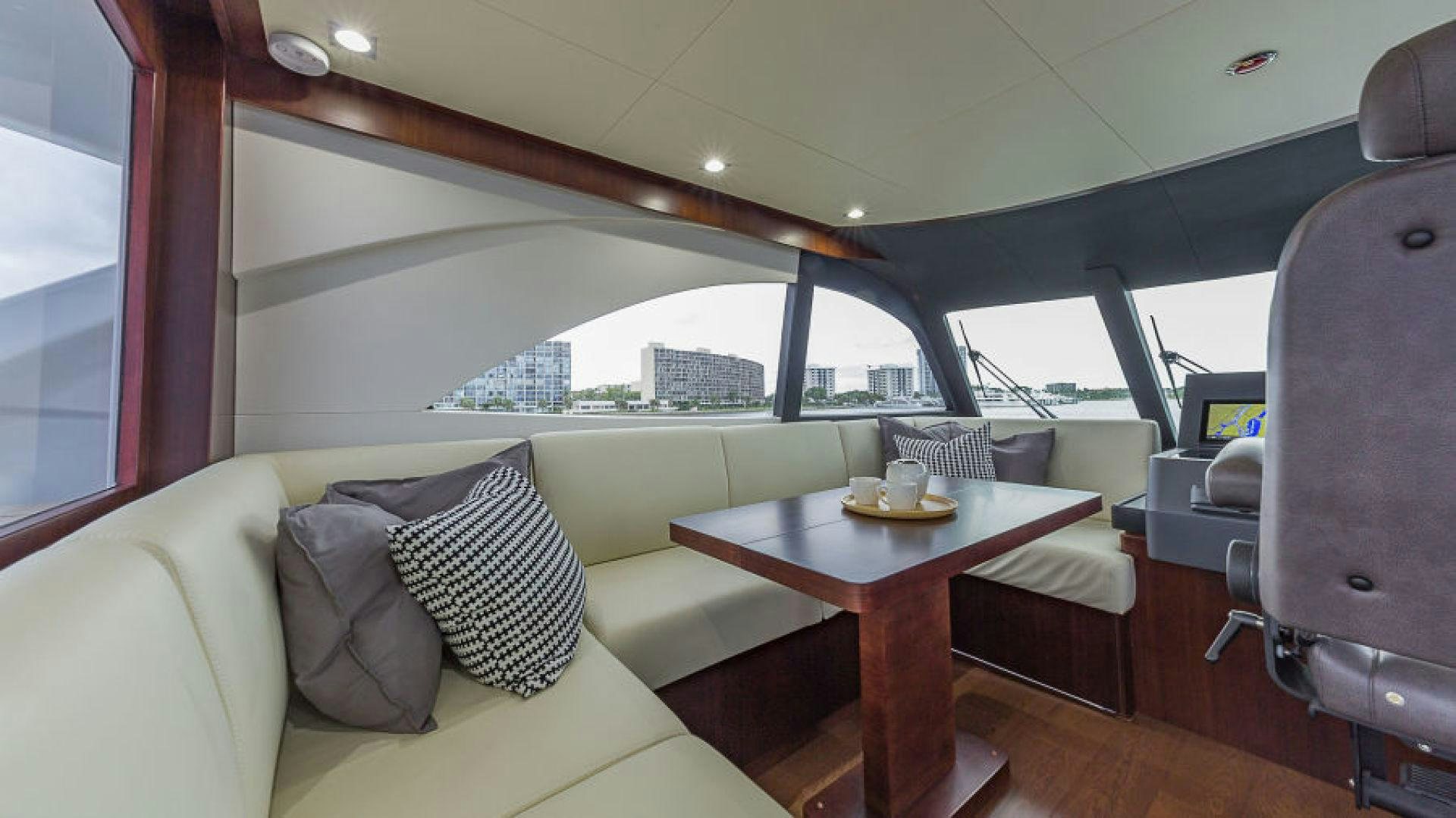 a room with a table and chairs aboard No Name Yacht for Sale