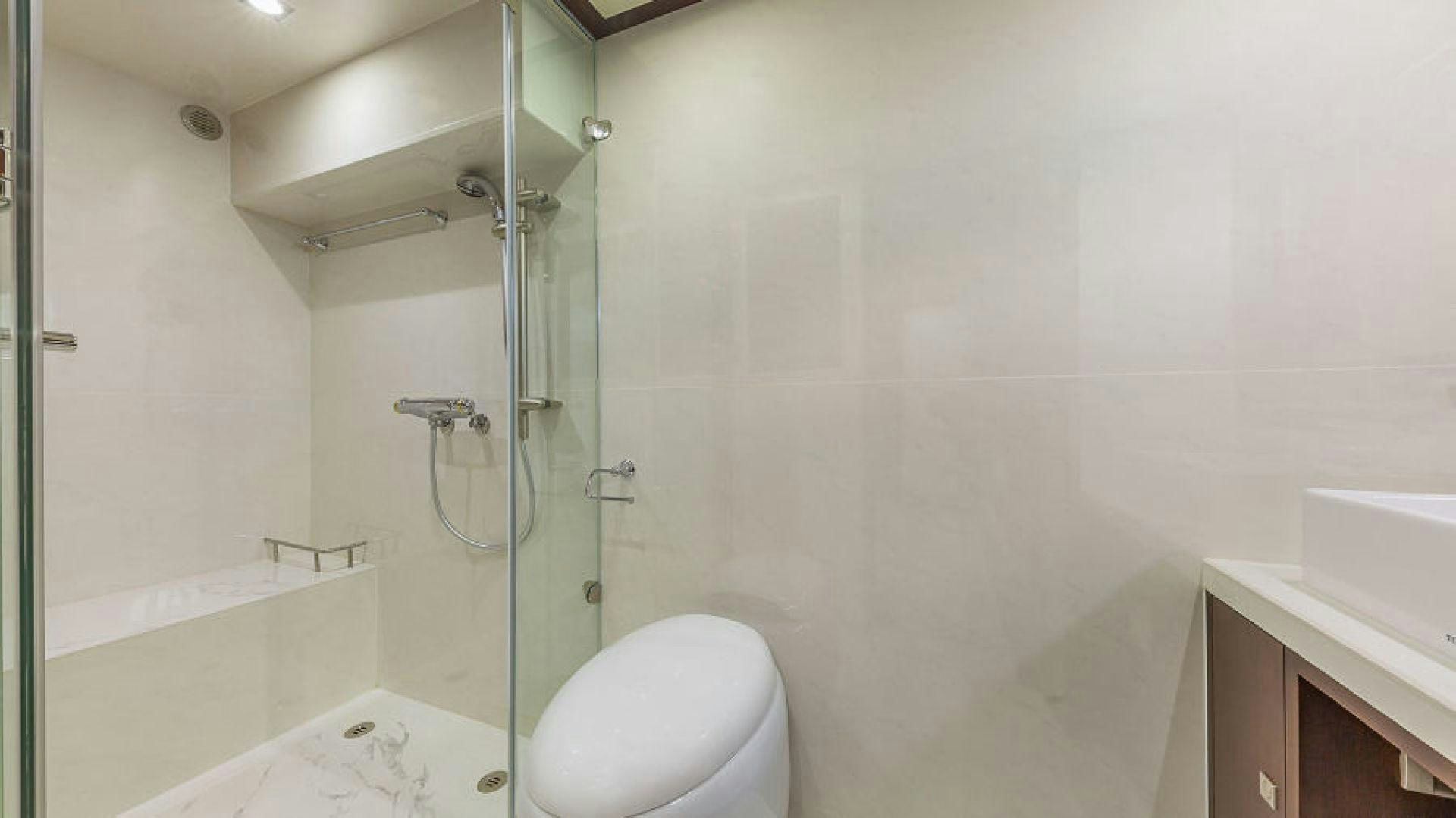 a bathroom with a glass shower aboard No Name Yacht for Sale