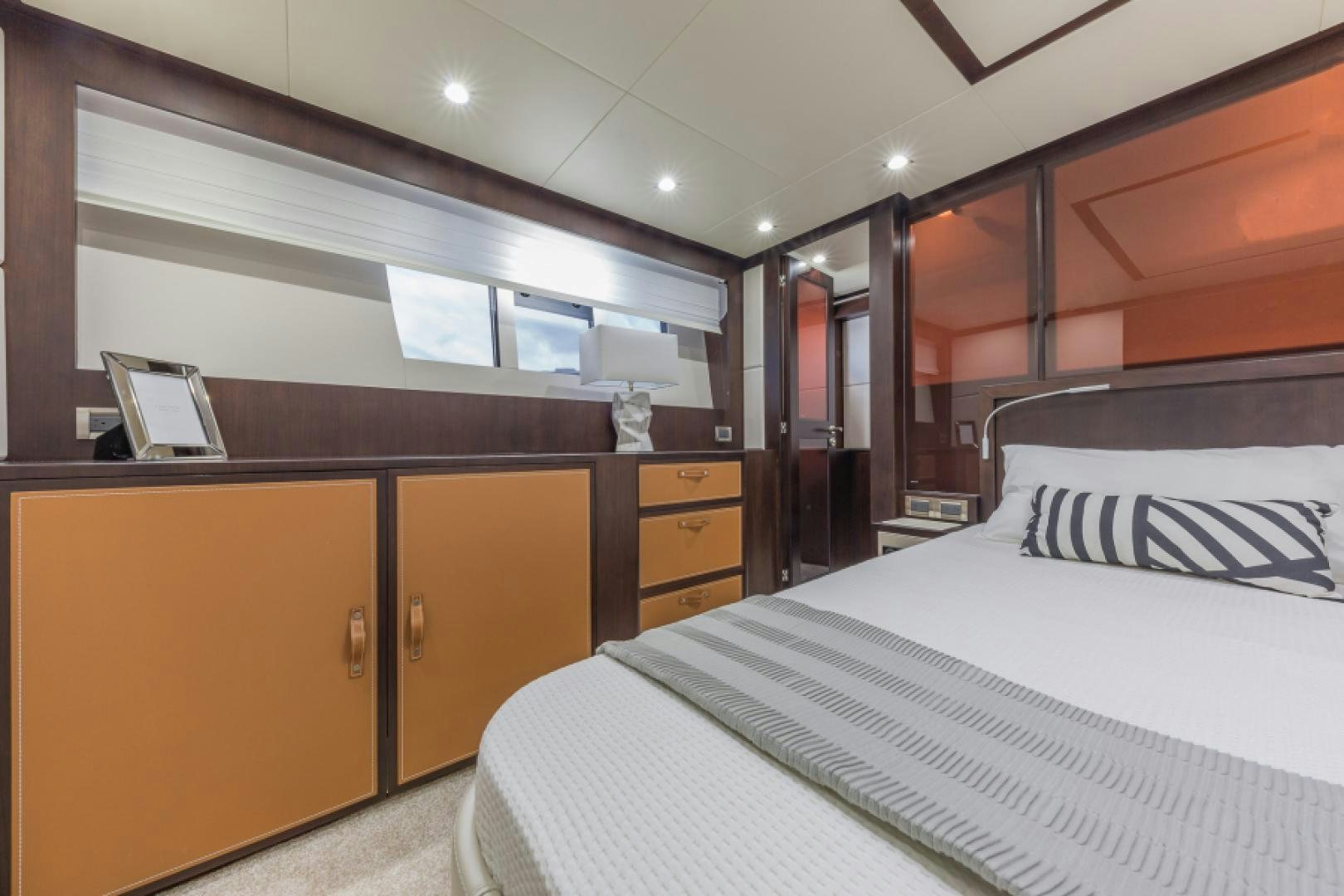 a room with a bed and a desk aboard No Name Yacht for Sale