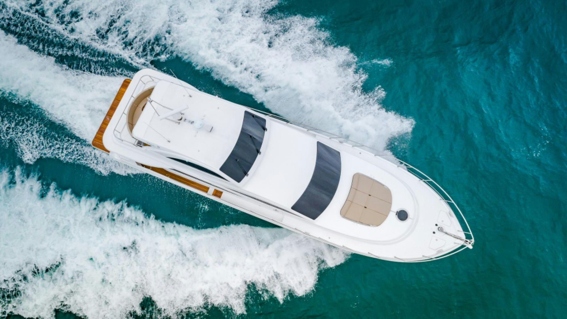 a white boat on the water aboard No Name Yacht for Sale