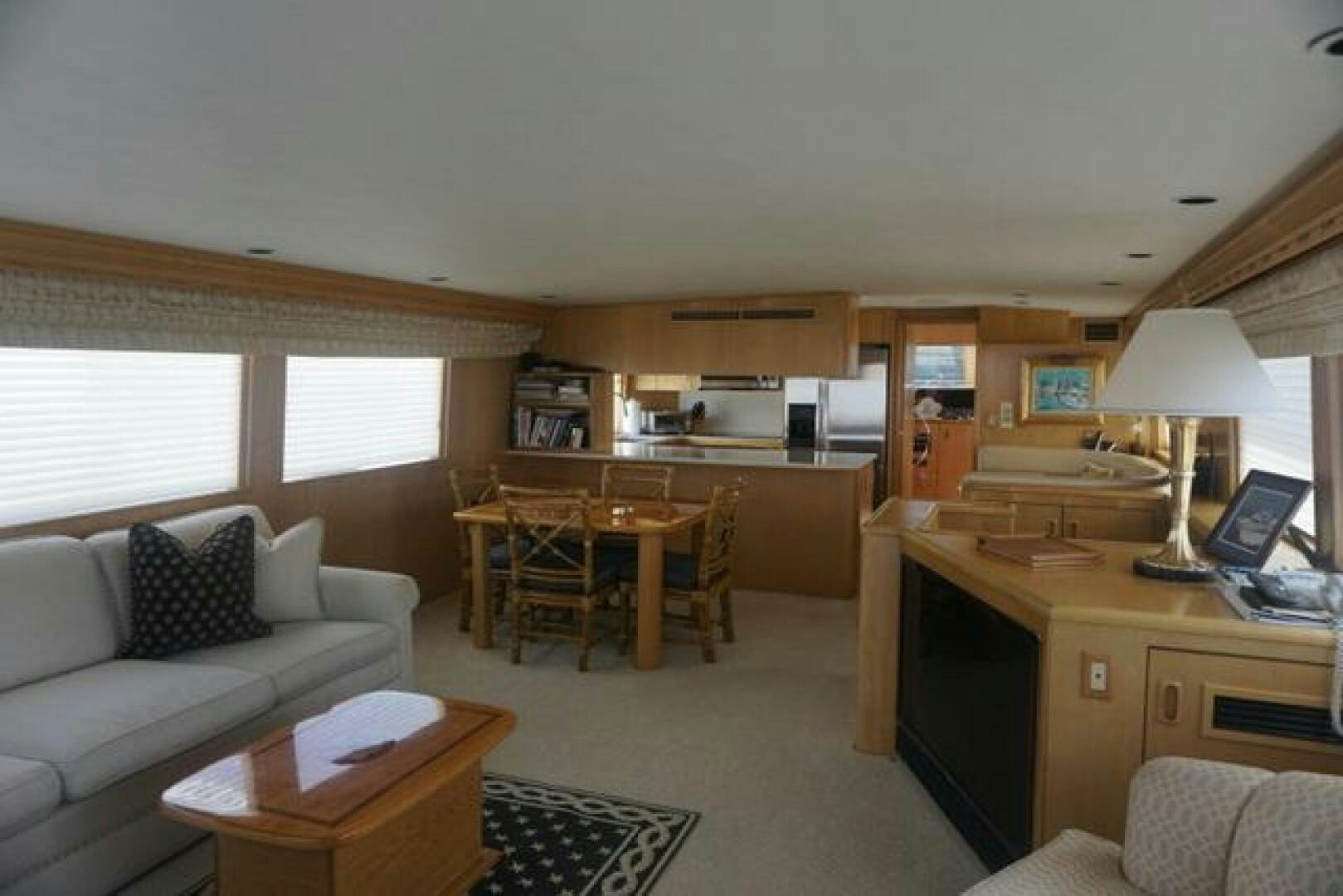 a living room with a kitchen and dining area aboard SILVER SEAS Yacht for Sale