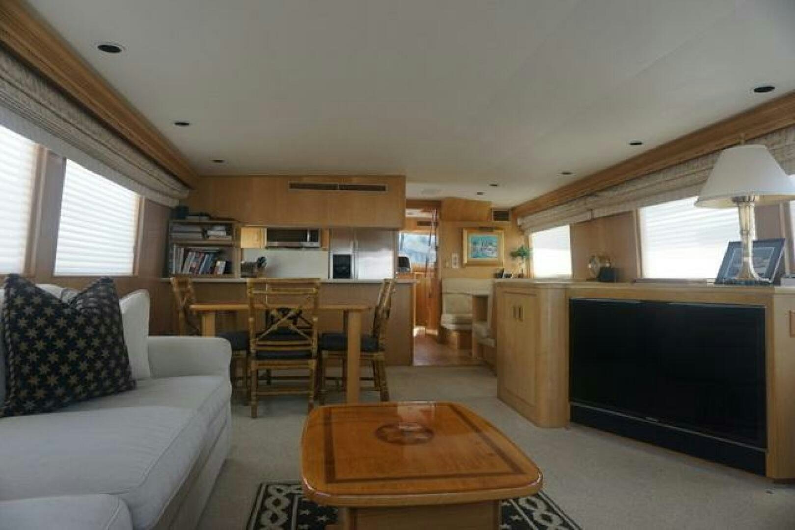 a living room with a fireplace aboard SILVER SEAS Yacht for Sale