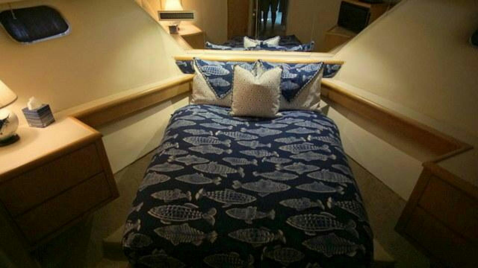 a bed with pillows aboard SILVER SEAS Yacht for Sale