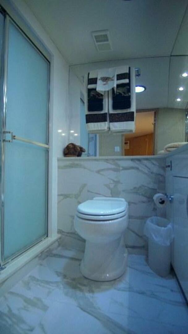 a dog sits in a bathroom aboard SILVER SEAS Yacht for Sale