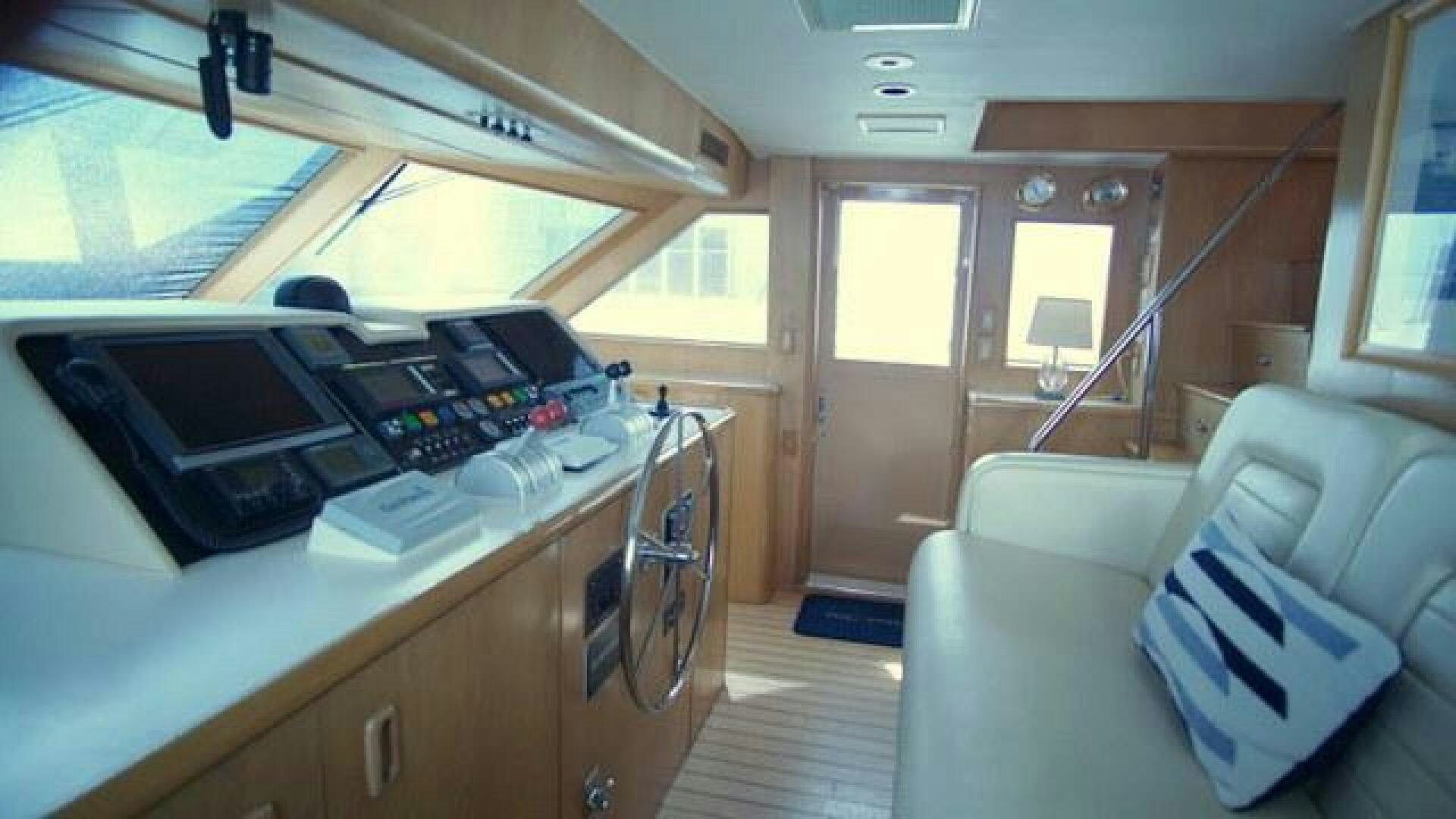 a room with a desk and a couch aboard SILVER SEAS Yacht for Sale
