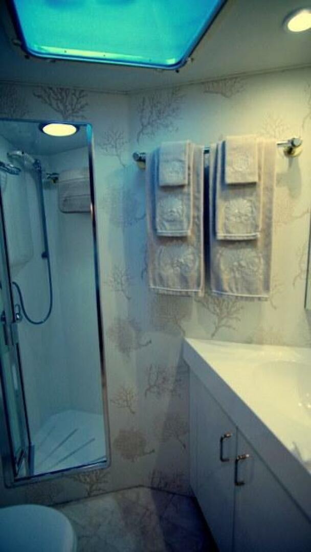 a bathroom with a shower curtain aboard SILVER SEAS Yacht for Sale