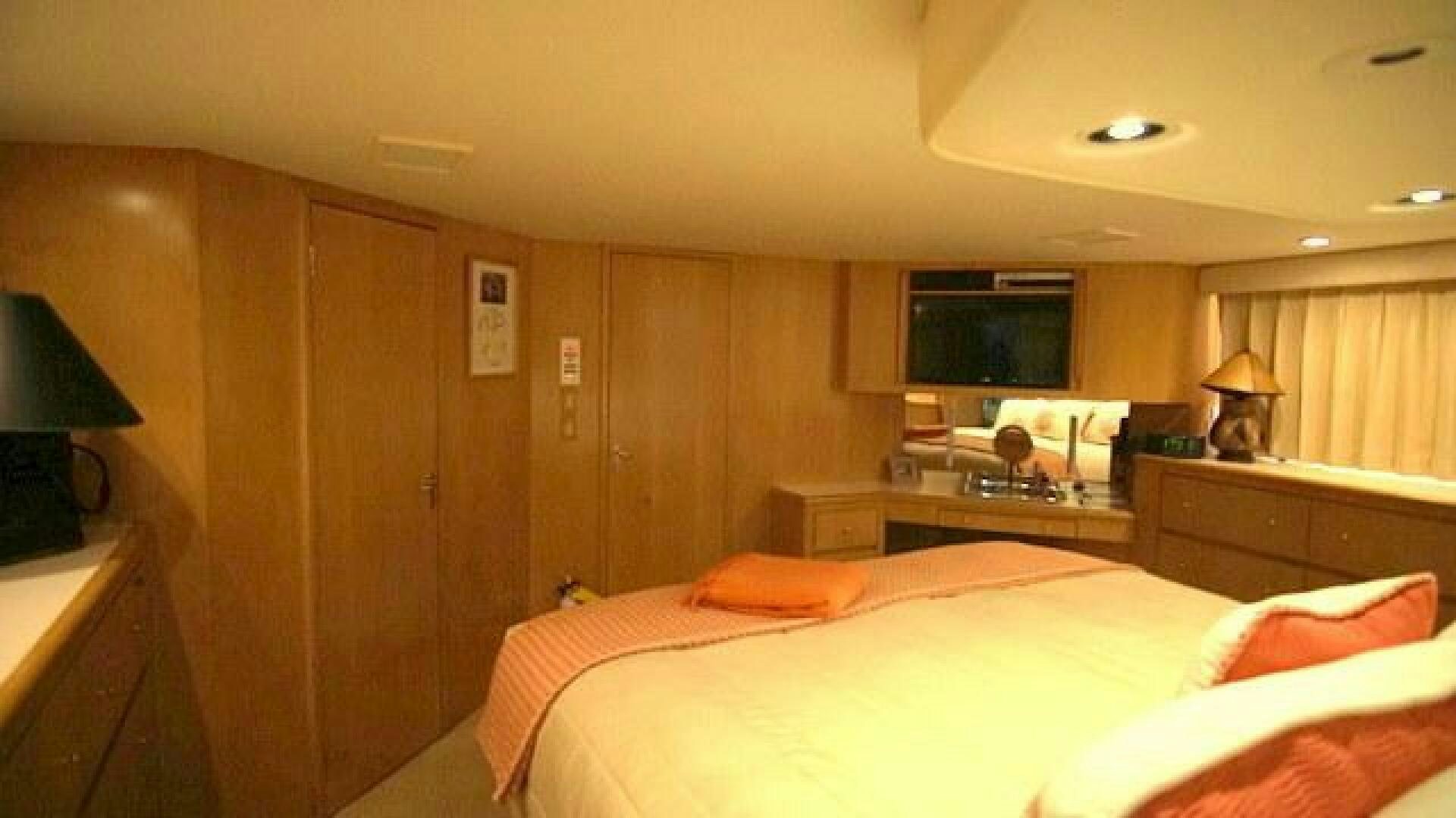 a bedroom with a bed and a television aboard SILVER SEAS Yacht for Sale