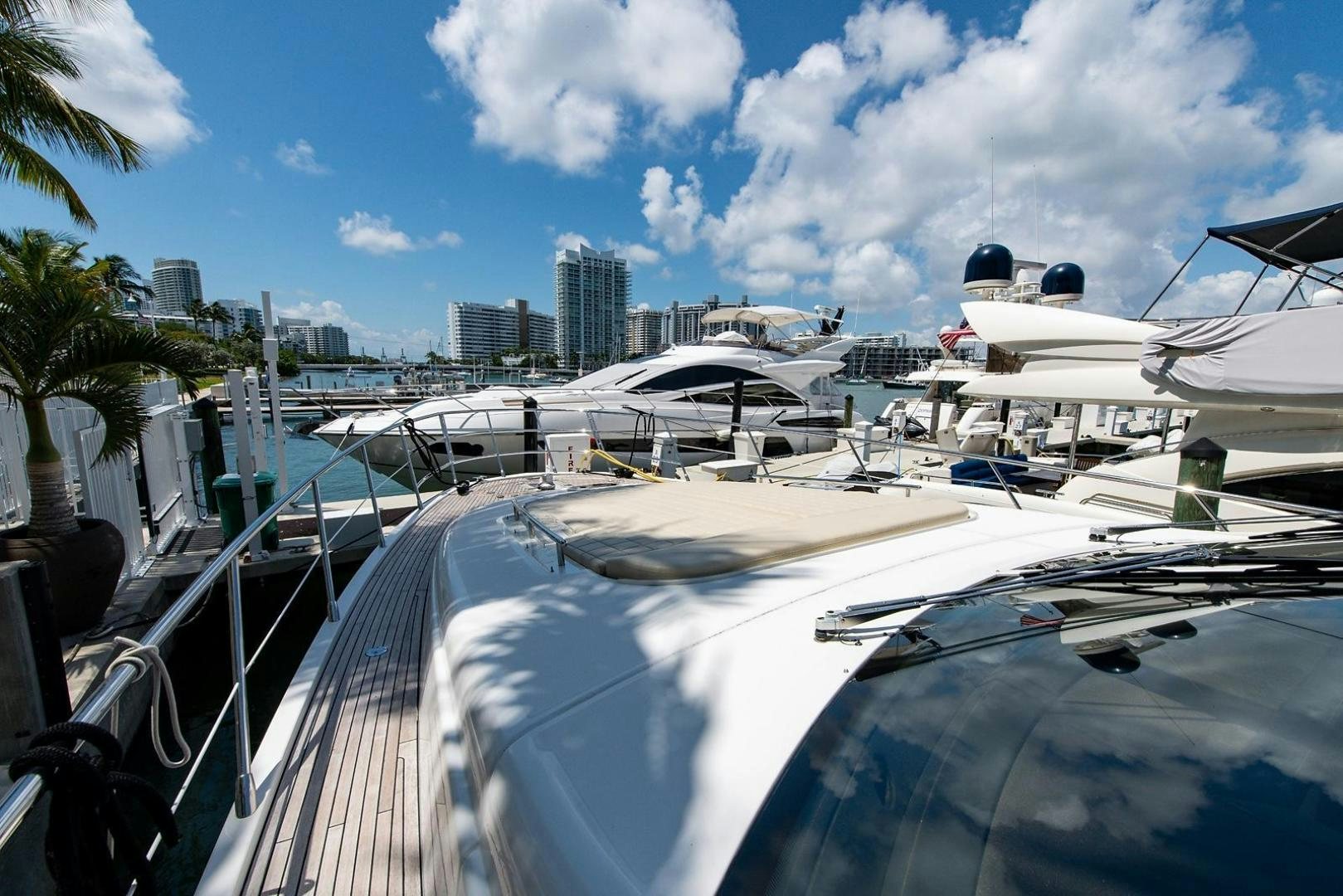 a deck with many boats aboard SOMEWHERE I BELONG Yacht for Sale