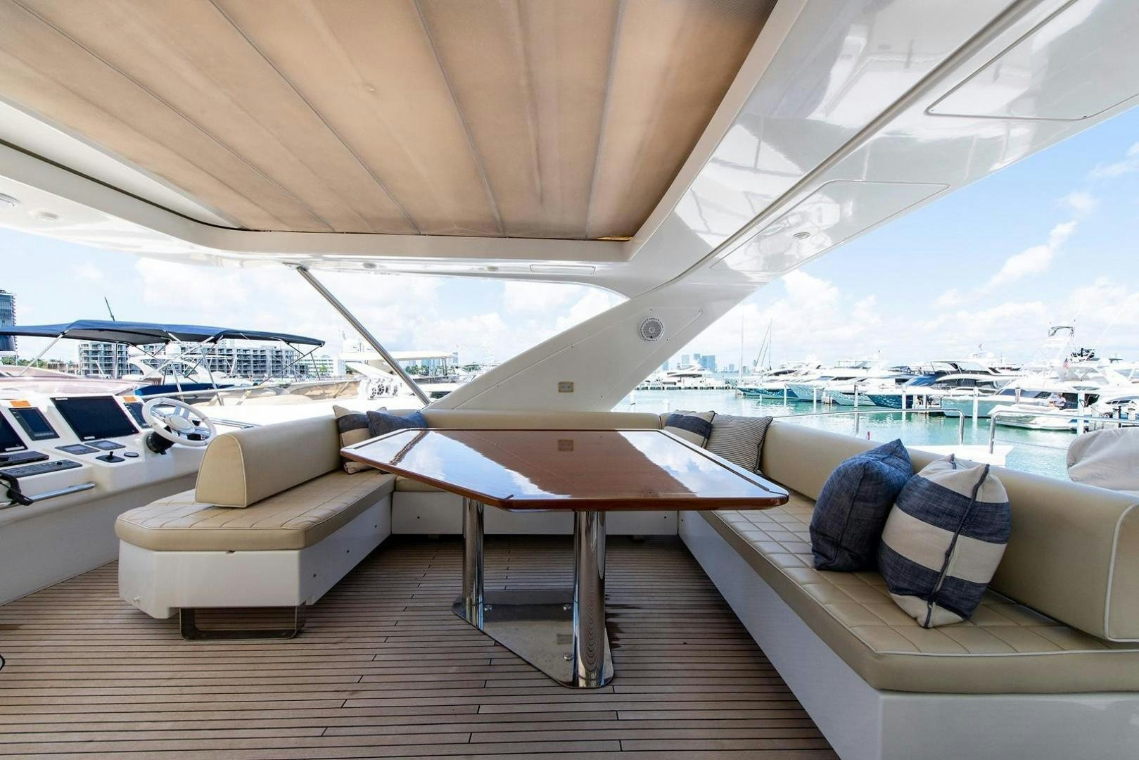 a table and chairs on a deck aboard SOMEWHERE I BELONG Yacht for Sale