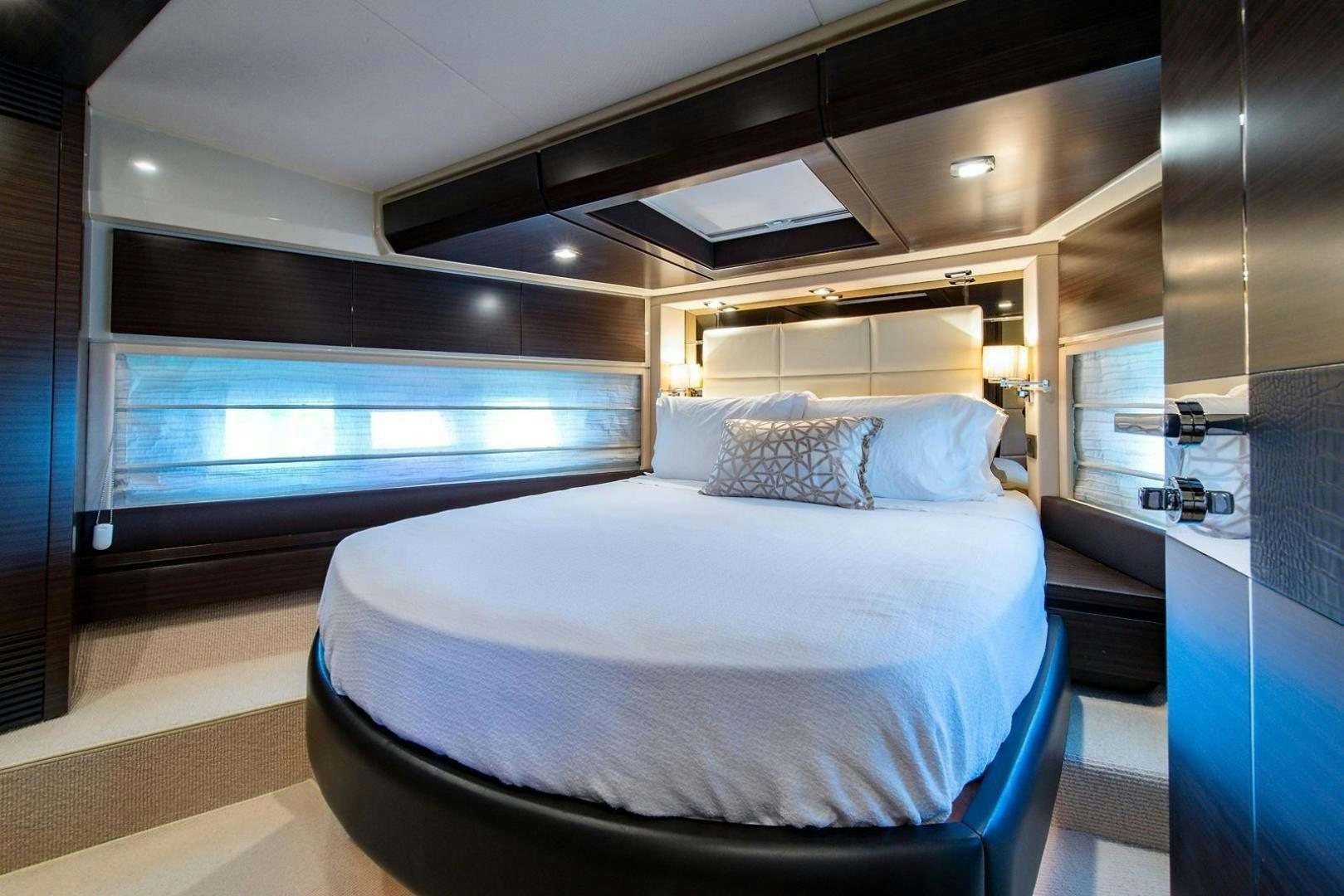 a bed in a room aboard SOMEWHERE I BELONG Yacht for Sale