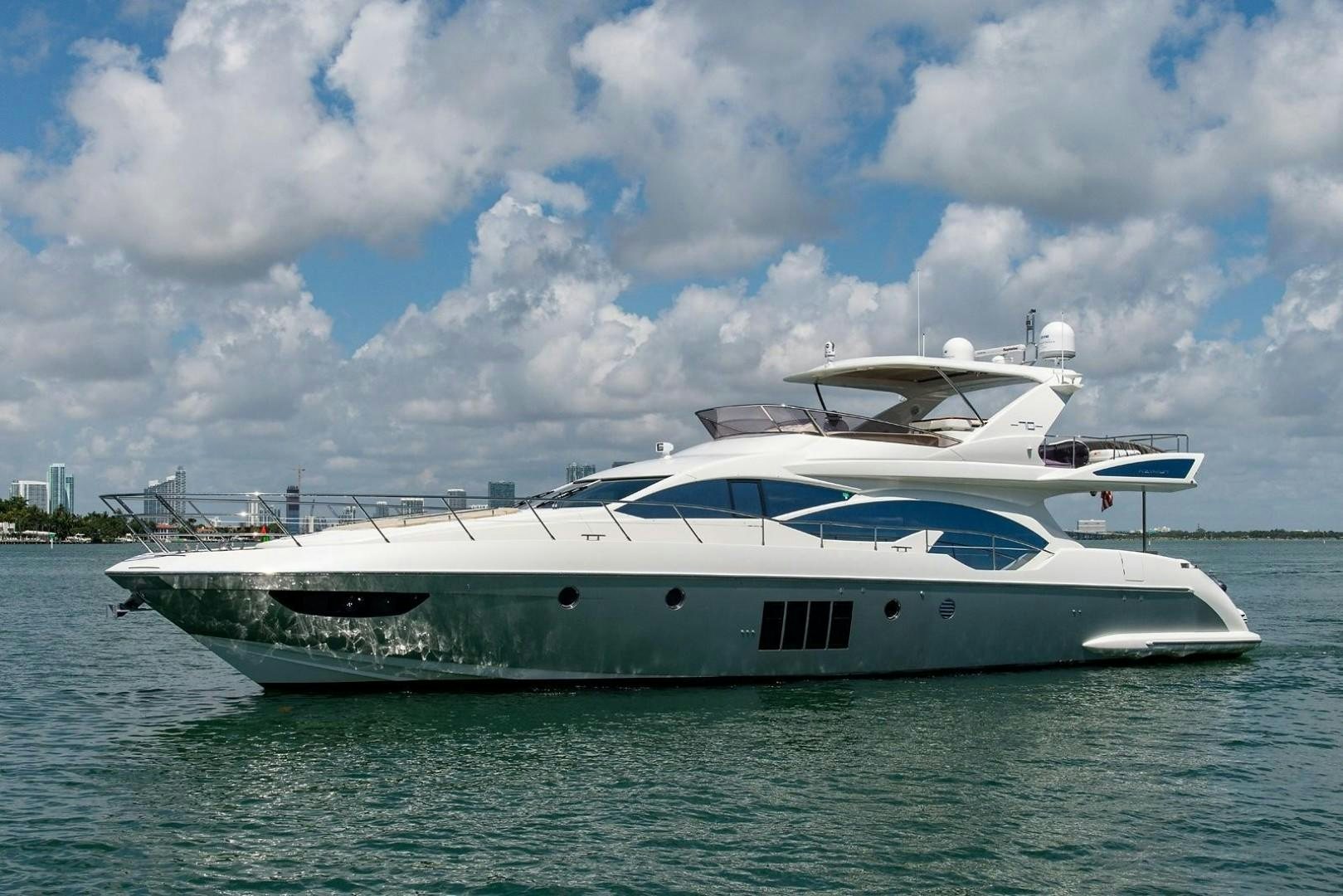 a white yacht in the water aboard SOMEWHERE I BELONG Yacht for Sale