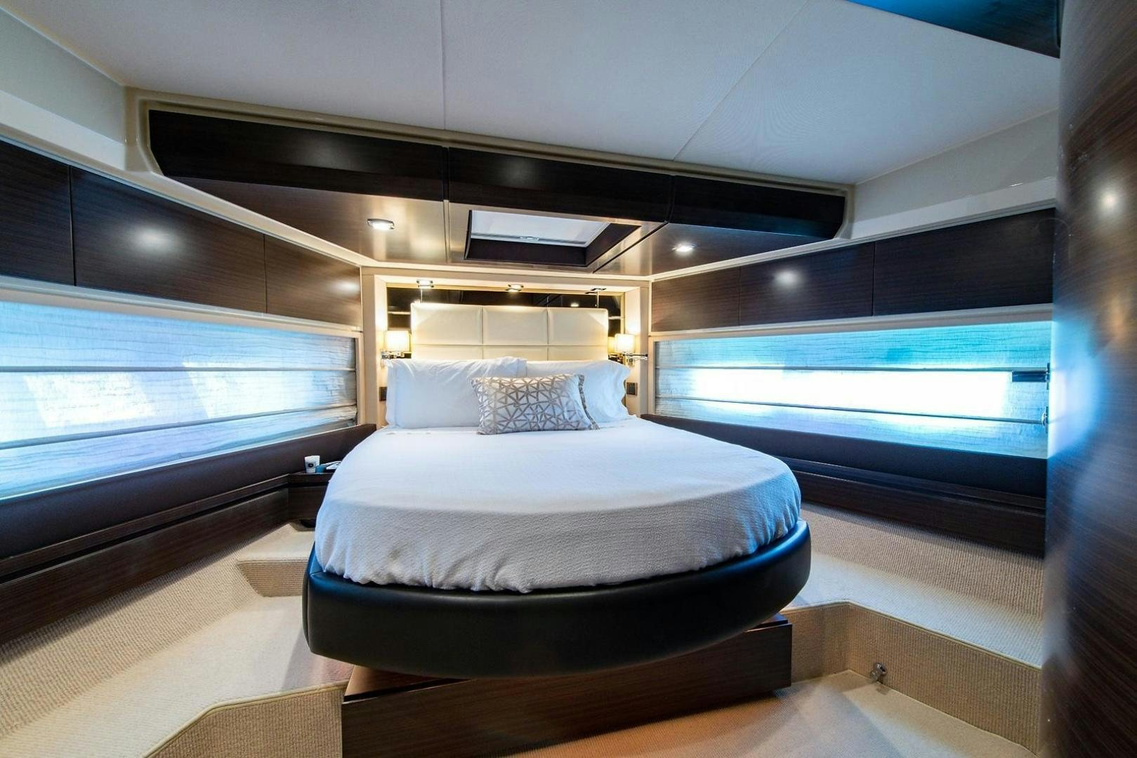 a bed in a room aboard SOMEWHERE I BELONG Yacht for Sale