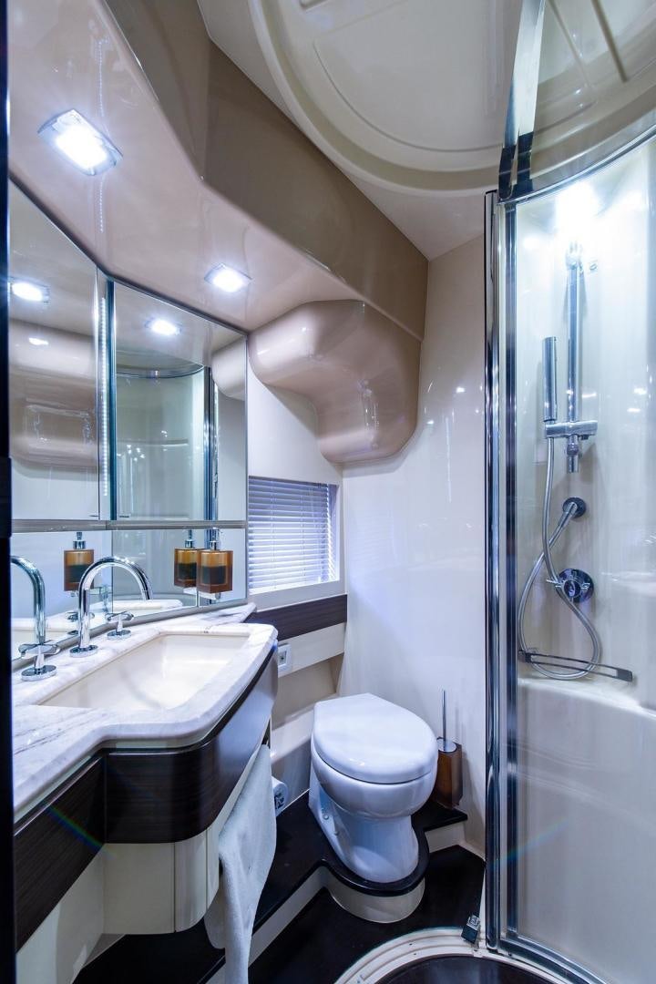 a bathroom with a glass shower aboard SOMEWHERE I BELONG Yacht for Sale