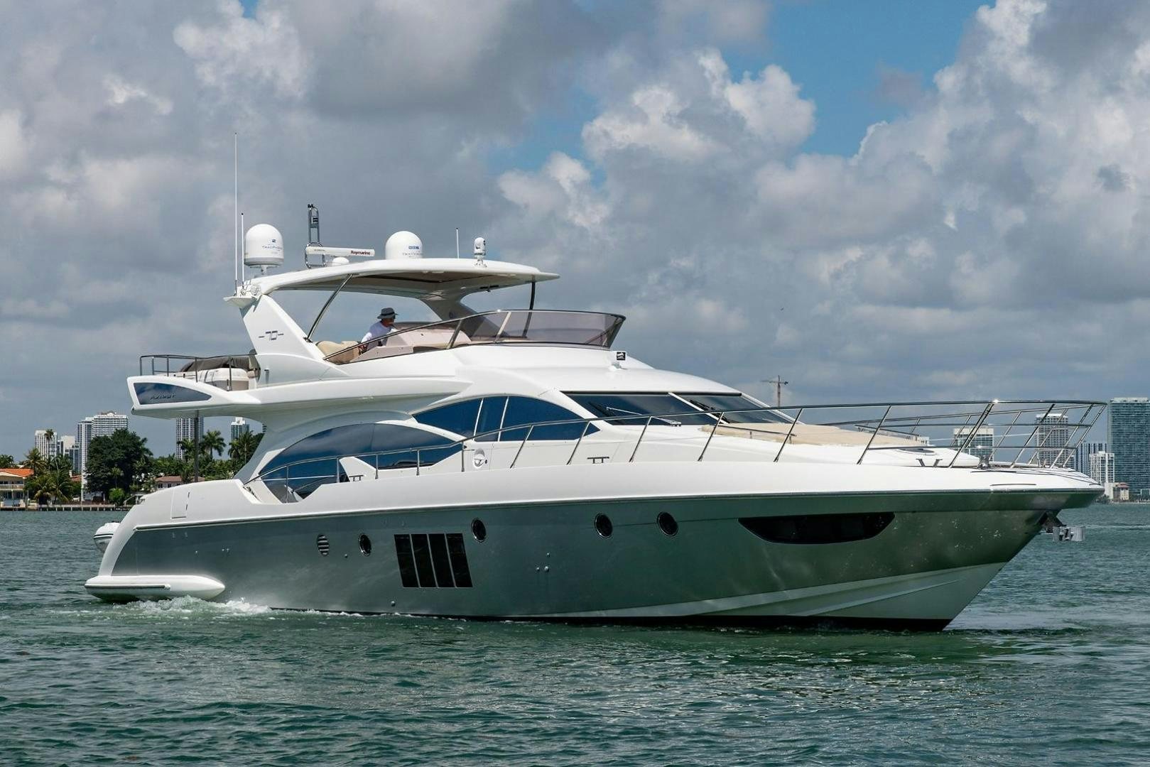 a white yacht in the water aboard SOMEWHERE I BELONG Yacht for Sale