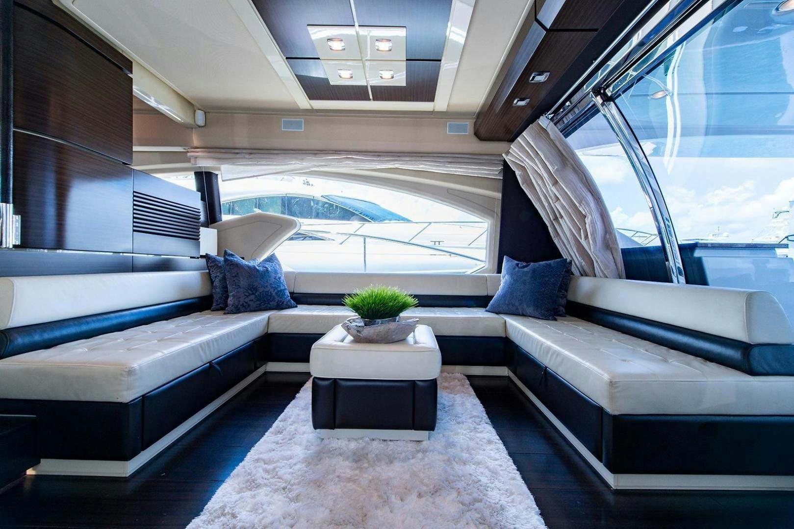 a room with a couch and a table aboard SOMEWHERE I BELONG Yacht for Sale